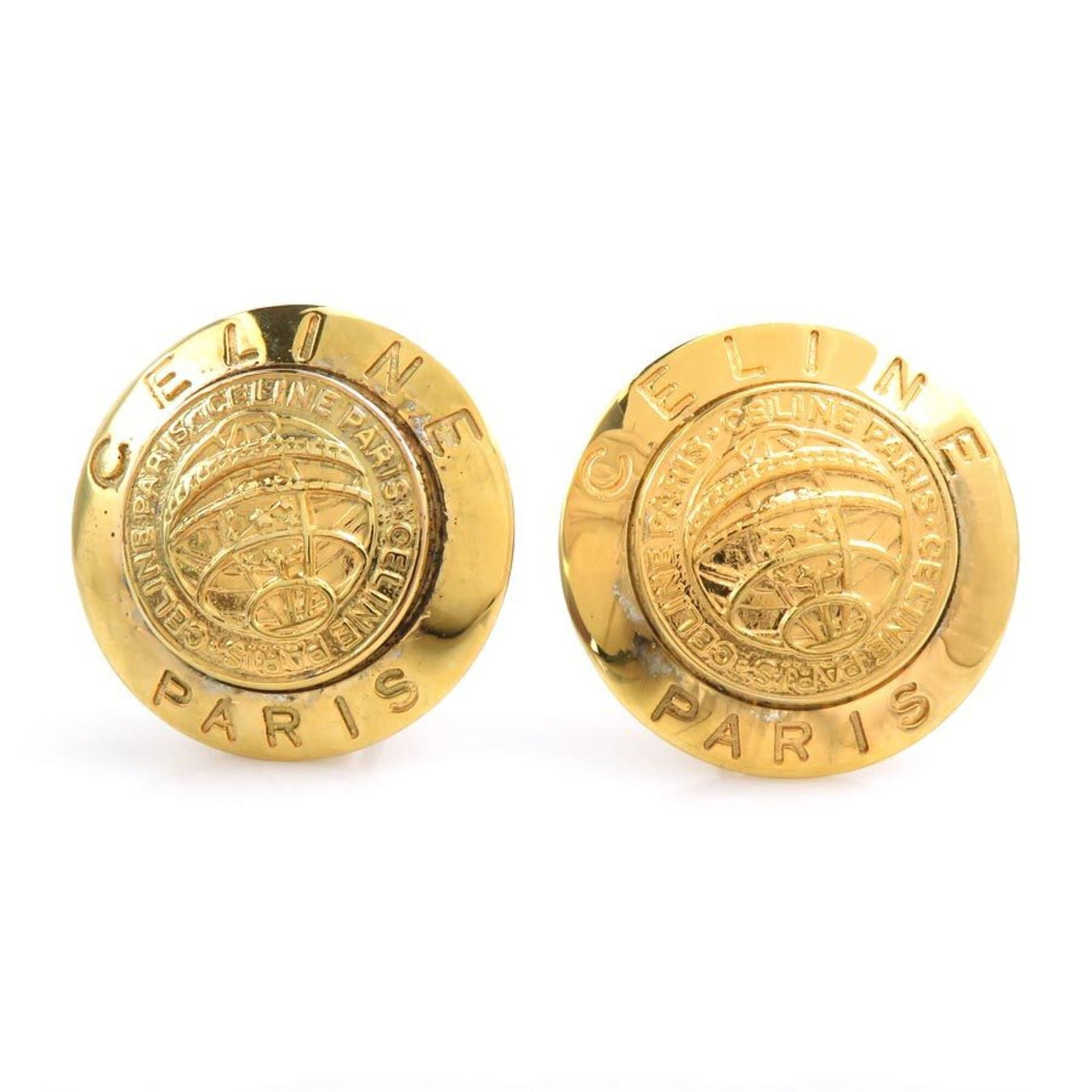 Celine metal earrings clip: Celine metal earrings clip Clip earrings in gold metal, designed by Celine. Made from high-quality metal, these clip earrings shine with a touch of luxury. Item Specifics: Brand: Celine Type: Clip