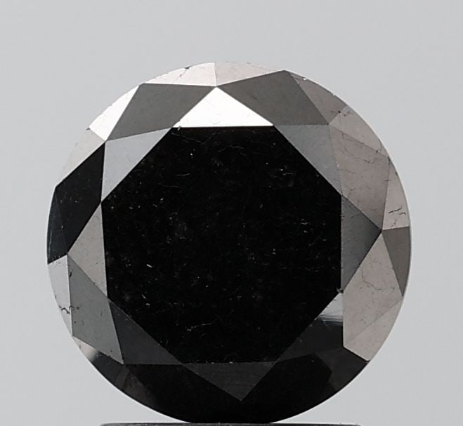 Round 2.57ct Black VVS2 - Loose Natural Diamond: Round 2.57ct Black VVS2 - Loose Natural Diamond The 2.57ct Black VVS2 diamond boasts exceptional clarity and a rich, dark color, making it a standout among natural diamonds. Its EX cut and symmetry en