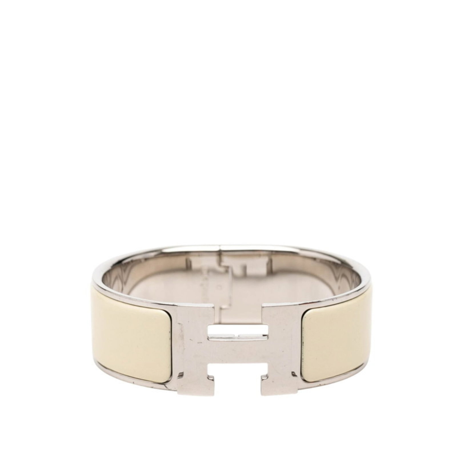 Metal Charm Hermes Bracelet: Metal Charm Hermes Bracelet Ivory and silver metal charm bracelet from Hermes, measuring 16.5cm in width. This charm bracelet features the brand's signature style with a classic design that exudes ele