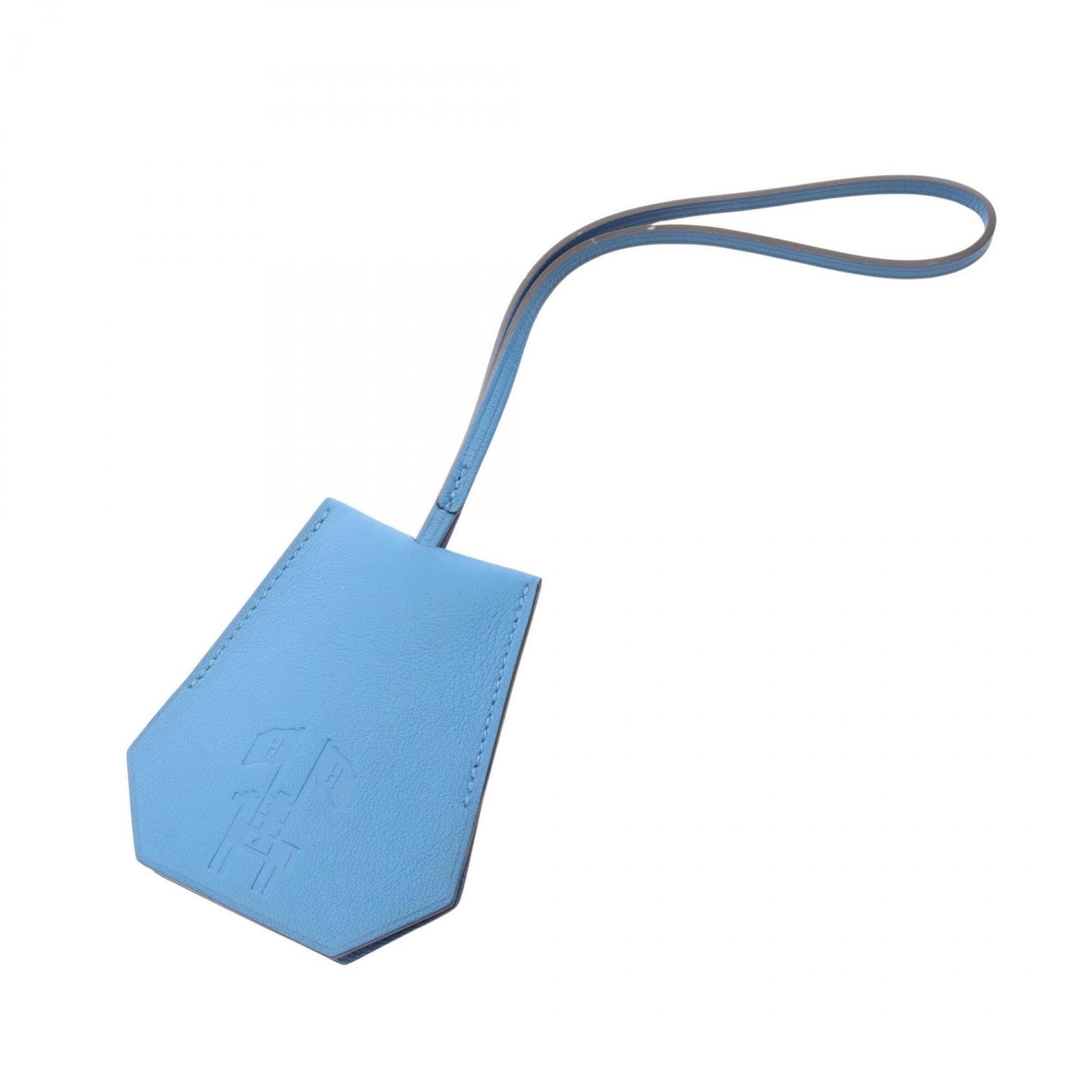 Swift leather handbag charm by Hermes: Swift leather handbag charm by Hermes Swift leather handbag charm by Hermes, made from high-quality Swift leather in a vibrant blue color. This charming accessory bears the signature of its creator, a