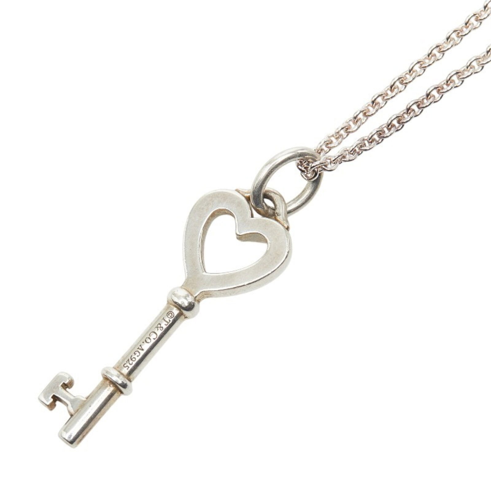 Silver Heart Motif Watch Key For Women By Tiffany: Silver Heart Motif Watch Key For Women By Tiffany Silver Heart Motif Watch Key For Women By Tiffany - A delicate silver pendant featuring an elegant heart motif, crafted from high-quality 925 sterling
