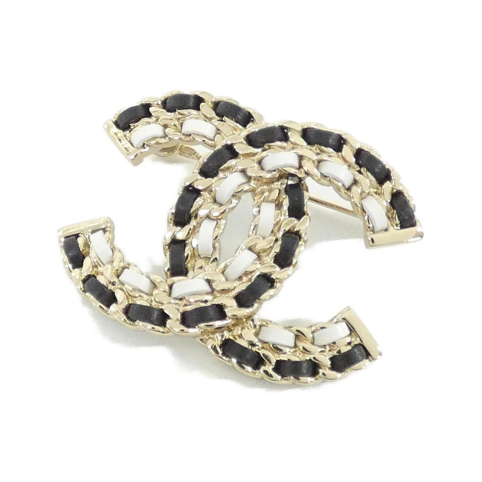 Leather brooch by Chanel