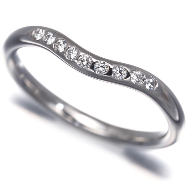 Diamond 9P Platinum Ring 950 Us4.75 Curved By Tiffany&Co: Diamond 9P Platinum Ring 950 Us4.75 Curved By Tiffany&Co Tiffany & Co.'s platinum ring boasts a striking curved design, showcasing a beautiful diamond set within. The 950-plated metal construction pro