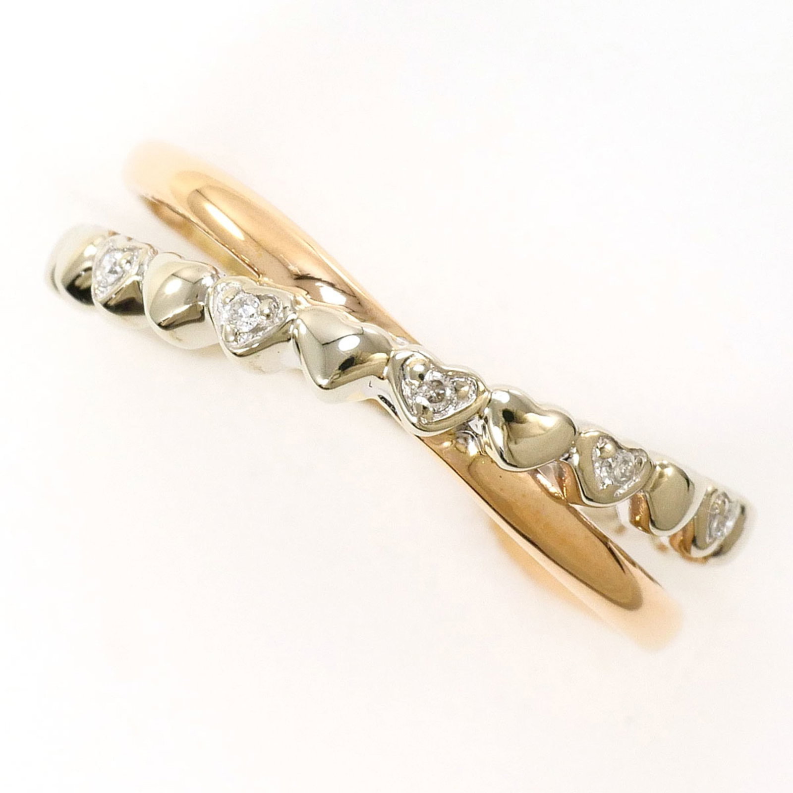 Unbranded Band Ring Pink Gold (10K) White Gold (10K): Unbranded Band Ring Pink Gold (10K) White Gold (10K) Pink gold and white gold band ring, available in sizes up to 4.5 US. This 10K metal piece features a diamond weighing 0.02 carats, set within a 5mm