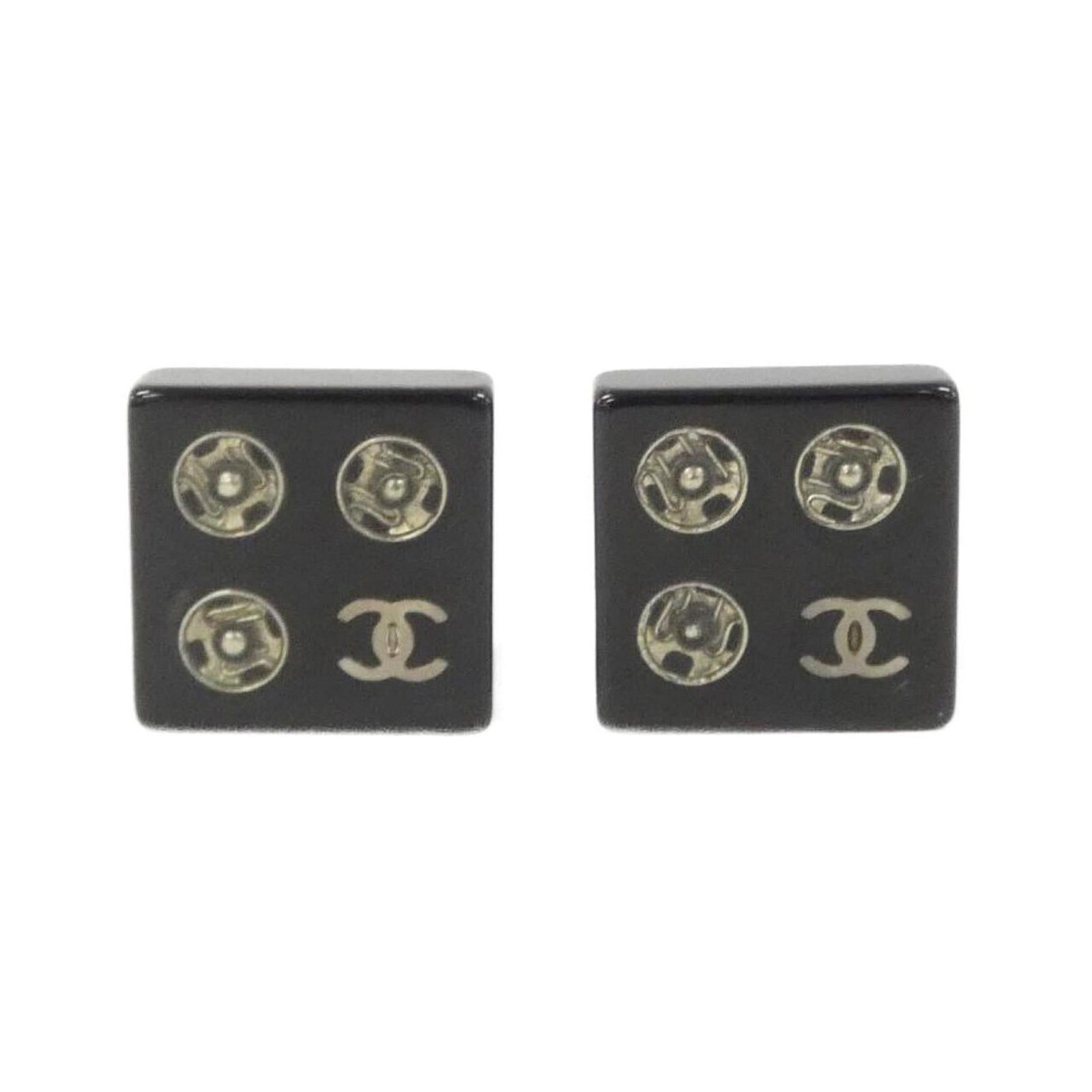 Chanel clip earrings: Chanel clip earrings Black Chanel clip earrings with a sleek, silver finish and precise dimensions of 16.00mm x 0.63''. The minimalist design makes them a versatile accessory for everyday wear. Item S