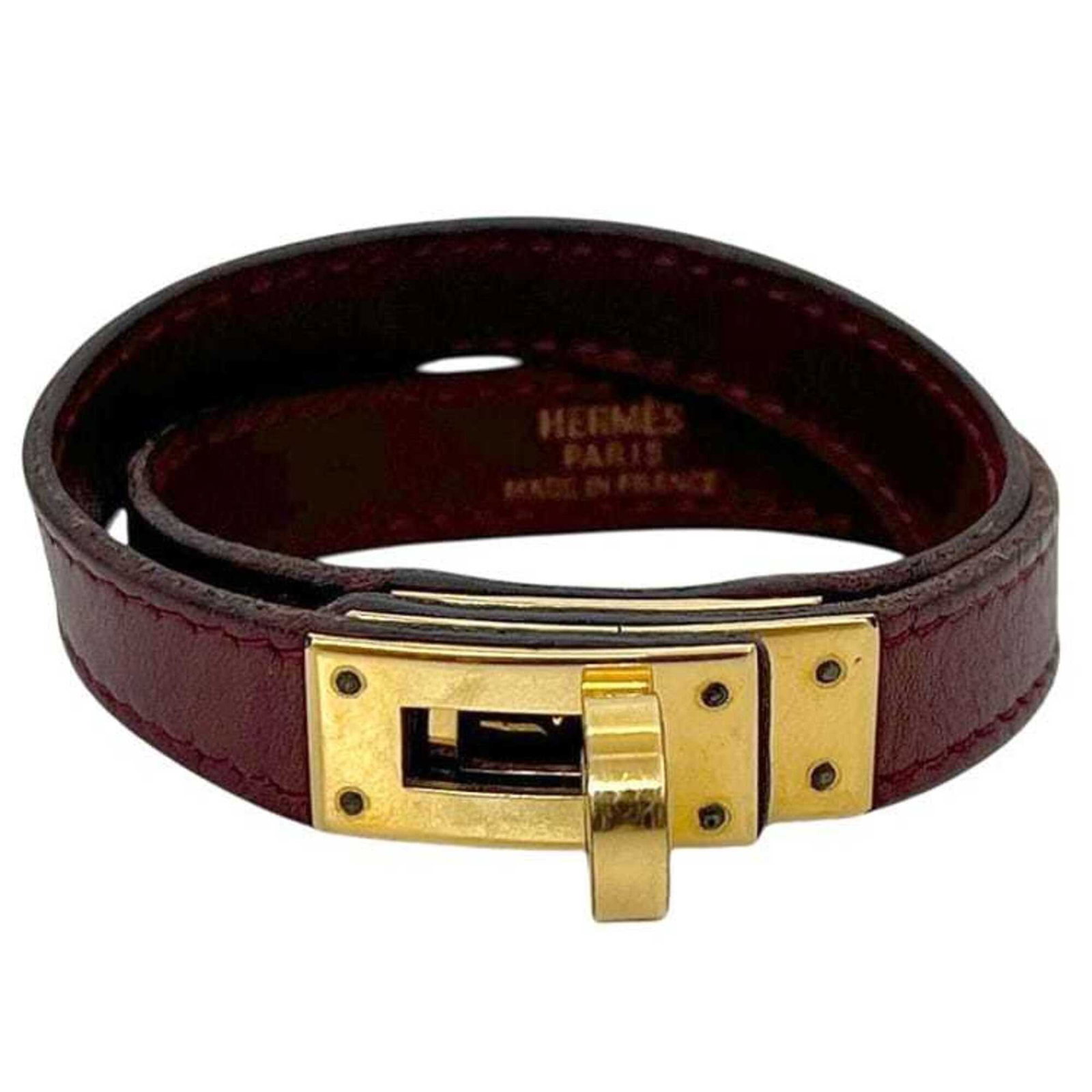 Hermes Charm Bracelet Leather: Hermes Charm Bracelet Leather Bordeaux leather wraps around the wrist in a sleek, 15cm charm bracelet from Hermes. The subtle 1.2cm width and total length of 36cm make for a comfortable fit. This Kell