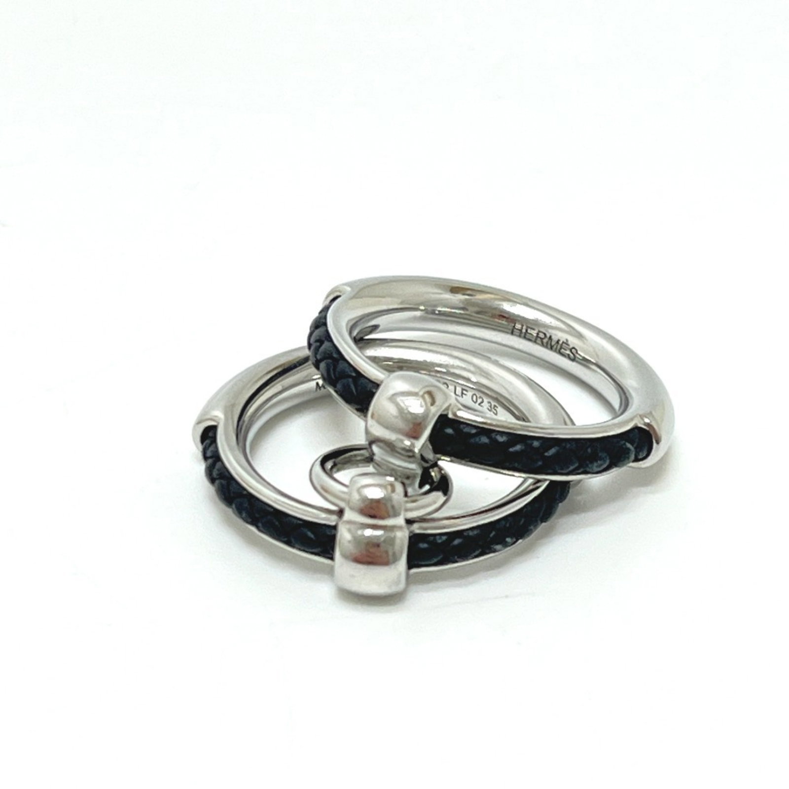 Metal ring band by Hermes: Metal ring band by Hermes Silver metal band ring from Italian luxury brand Hermes, featuring a classic design with a US size 10.5 fit. This sleek and sophisticated ring showcases the iconic style of H