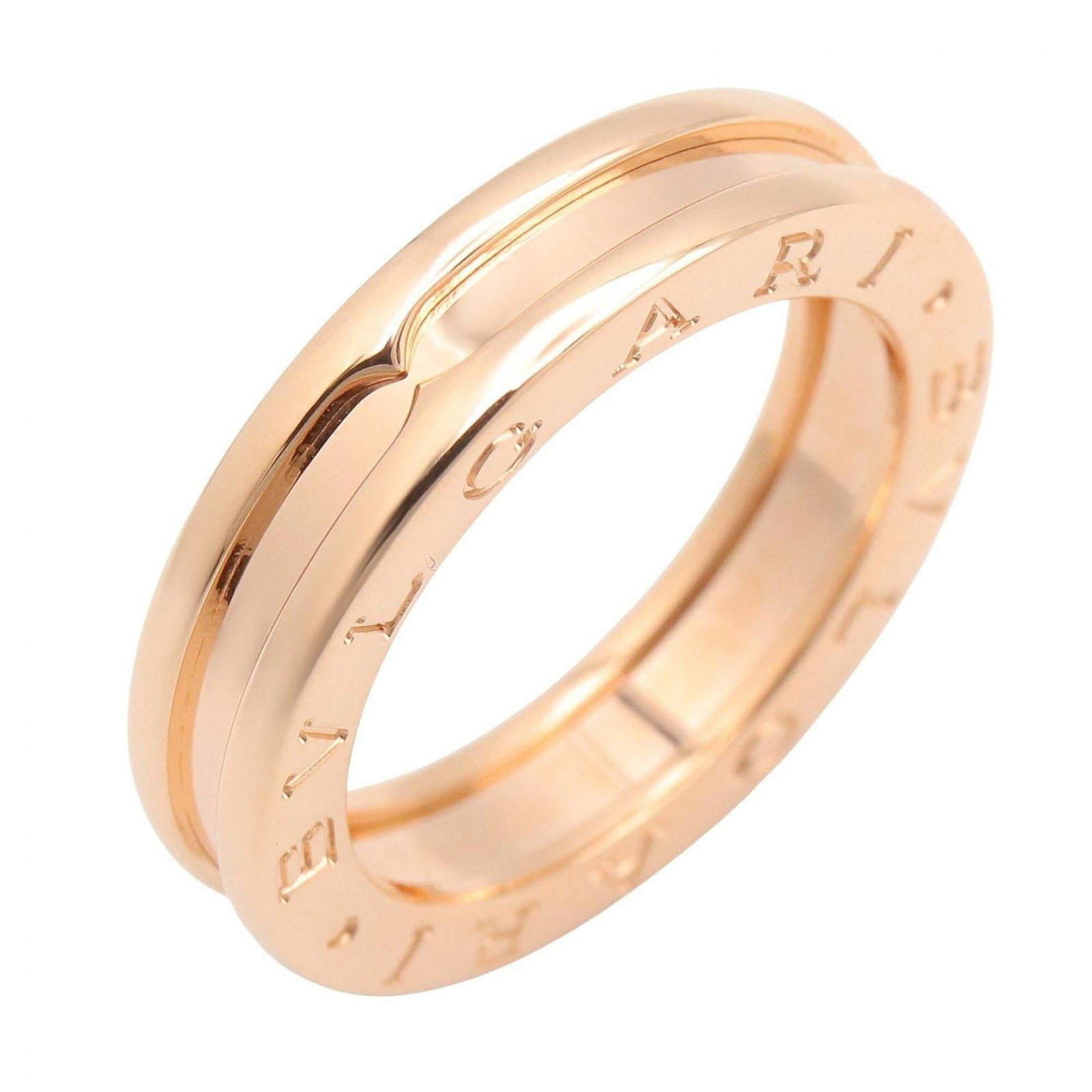 Pink gold band ring by Bvlgari 18k: Pink gold band ring by Bvlgari 18k Pink gold band ring by Bvlgari, featuring 18k pink gold material and a US size 6 fit. This elegant ring showcases the luxury brand's signature style with its