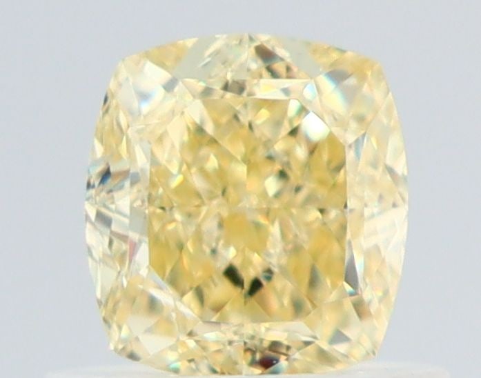 GIA Cushion Brilliant 0.73ct Fancy Yellow VVS1 - Loose Natural Diamond: GIA Cushion Brilliant 0.73ct Fancy Yellow VVS1 - Loose Natural Diamond GIA certified, this 0.73ct Fancy Yellow VVS1 diamond boasts exceptional color and clarity, with a vibrant yellow hue that stands 