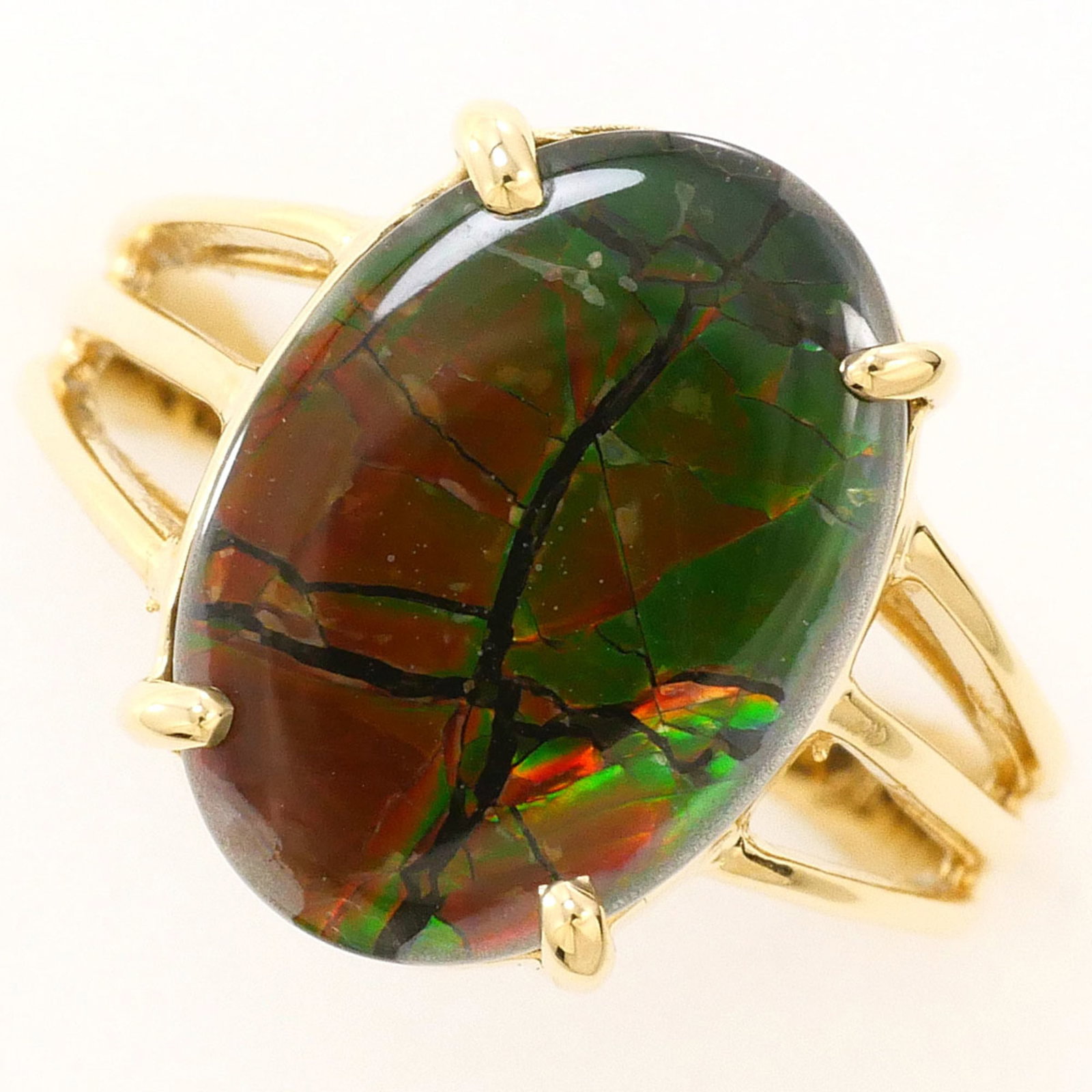 Unbranded Band Ring Yellow Gold (14K): Unbranded Band Ring Yellow Gold (14K) 14K yellow gold band ring with an ammolite stone, crafted from genuine 14K metal. The ring features a US size 4.5 width and weighs 3.4g. Its bright yellow gold hu