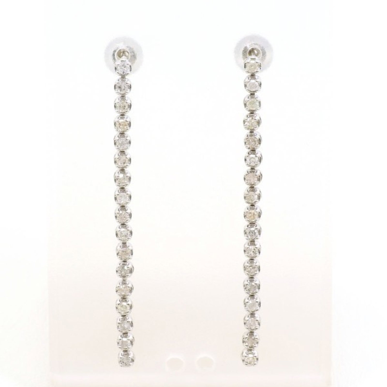 White Gold 14K Unbranded Earrings Drop: White Gold 14K Unbranded Earrings Drop White gold (14K) earrings drop in a sleek, understated design. Featuring a diamond stone weighing 0.22 carats, these earrings showcase the beauty of white gold w