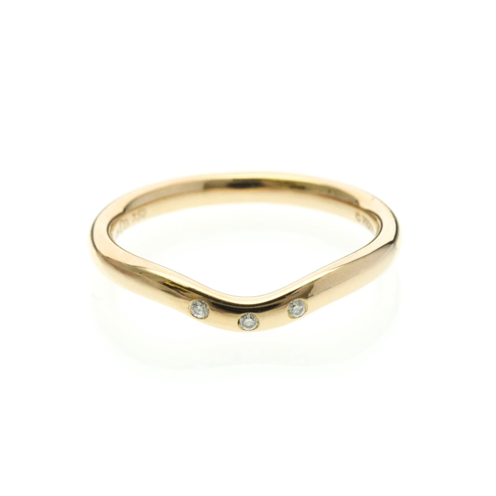 Tiffany Band Ring Pink Gold (18K): Tiffany Band Ring Pink Gold (18K) Pink gold band ring with three diamonds, crafted from 18K metal, offers a touch of elegance in its curved design. The subtle pink hue and diamond accents create a