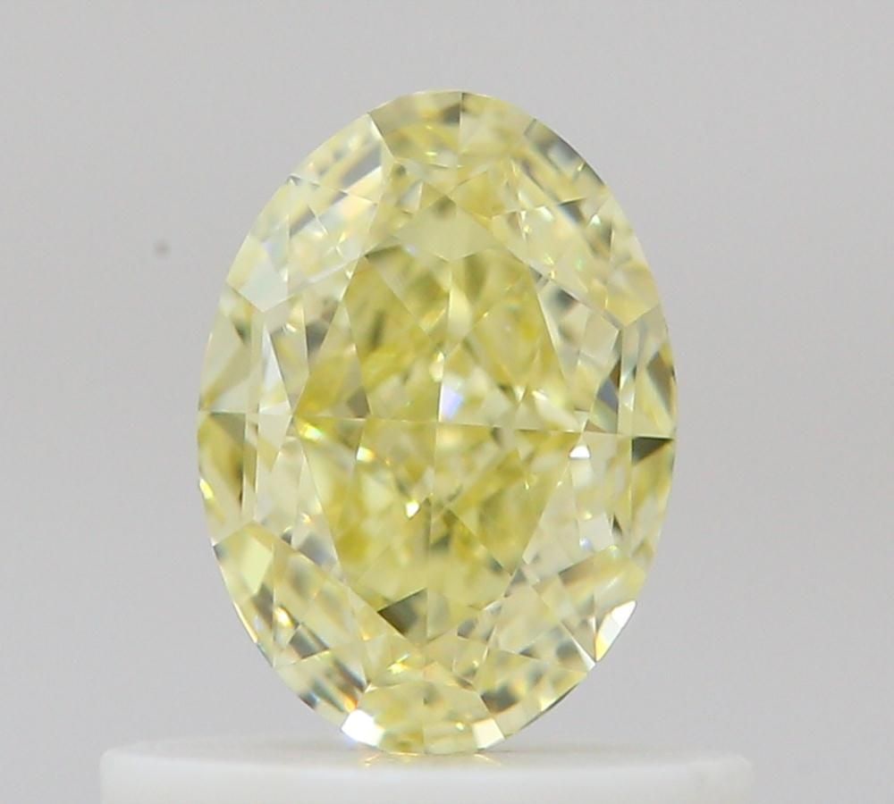 GIA Oval 0.66ct Fancy Light Yellow VVS2 - Loose Natural Diamond: GIA Oval 0.66ct Fancy Light Yellow VVS2 - Loose Natural Diamond GIA Oval 0.66ct Fancy Light Yellow VVS2 - Loose Natural Diamond, certified by the Gemological Institute of America (GIA) as a Fancy