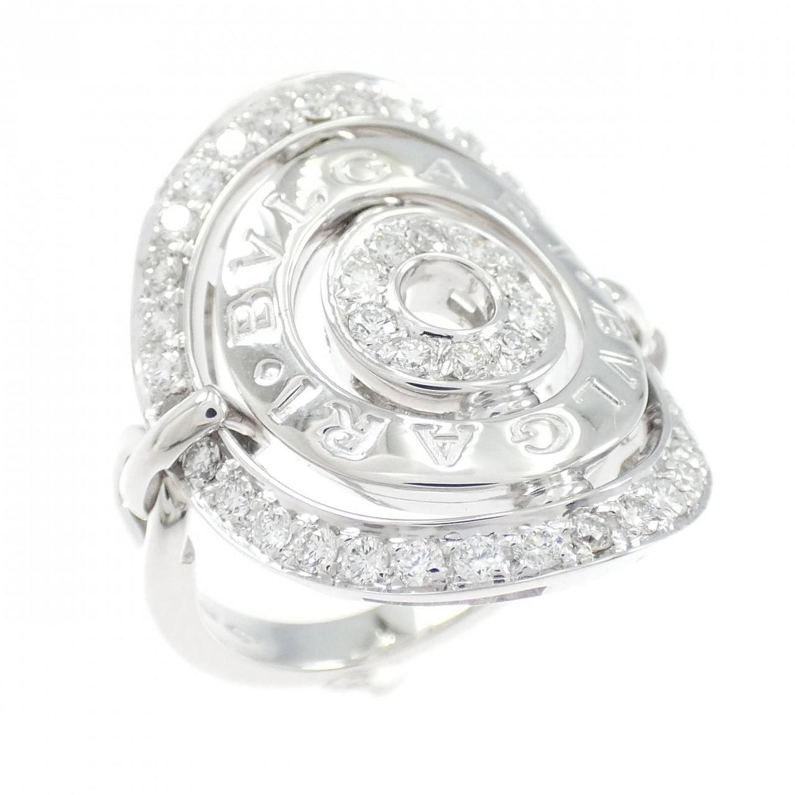 Bvlgari Band Ring White Gold (18K): Bvlgari Band Ring White Gold (18K) Bvlgari Band Ring in White Gold (18K) features a striking diamond stone set against an 18K white gold band, creating a sleek and sophisticated design. Measuring US s