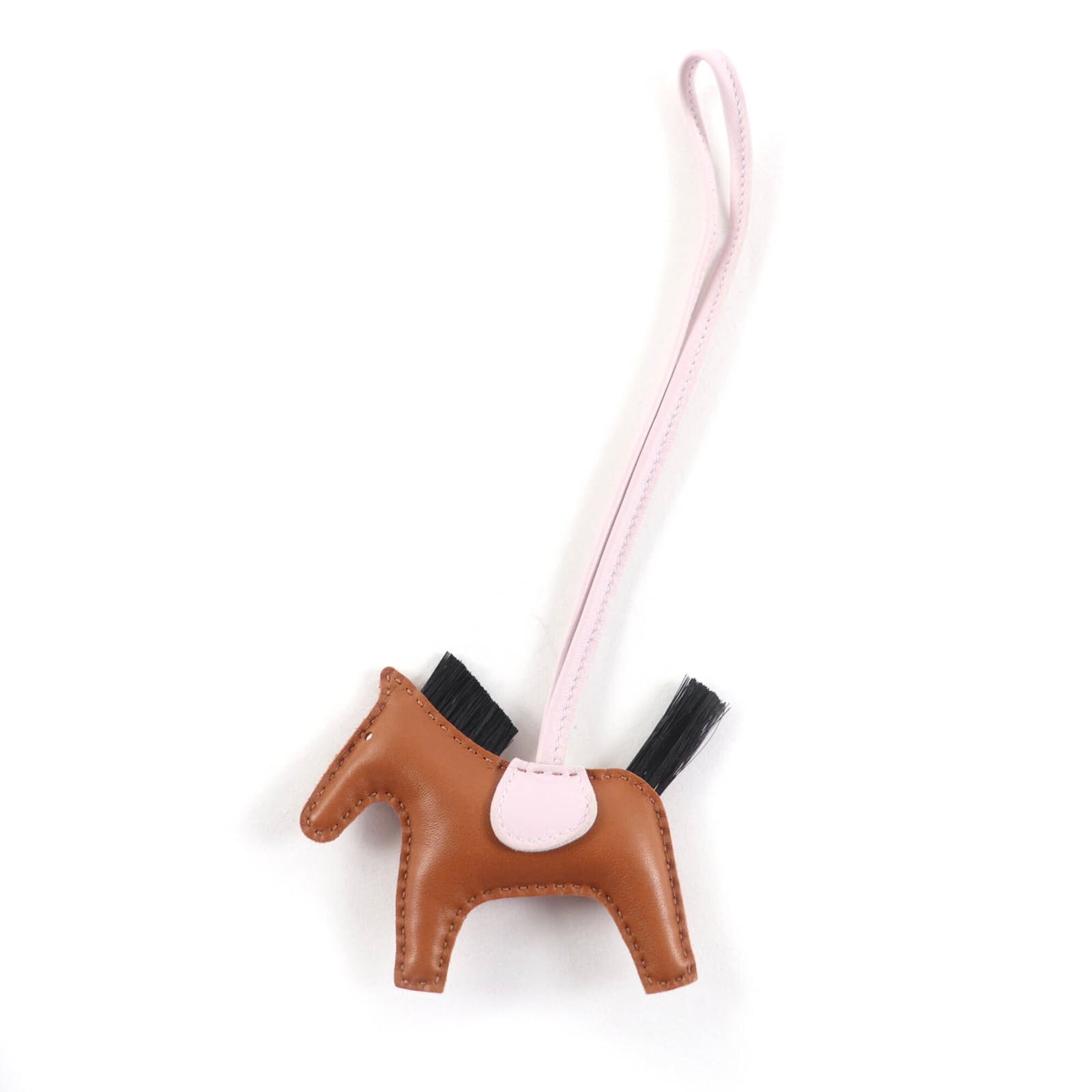 Agneau Handbag Charm Hermes: Agneau Handbag Charm Hermes Agneau Handbag Charm by Hermes features a sleek black and gold design, showcasing the iconic brand's signature style. Made from high-quality agneau milo material, this