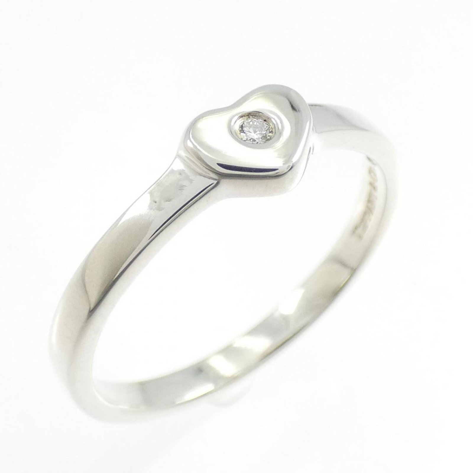 Silver Ring Band Tiffany: Silver Ring Band Tiffany Silver Ring Band Tiffany, US Size 6.5, features a diamond stone set in sterling silver (925) and is designed as a band ring for women. This elegant piece boasts a classic desi