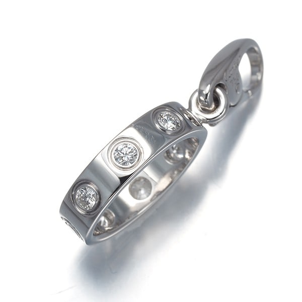 Diamond Love Pendant Cartier 18K White Gold: Diamond Love Pendant Cartier 18K White Gold Cartier's 18K white gold Diamond Love Pendant boasts a natural charm style, featuring a beautiful unmarked diamond stone. The pendant measures 13.5 x 3.4mm 