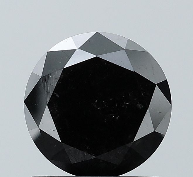 Round 1.27ct Black VVS2 - Loose Natural Diamond: Round 1.27ct Black VVS2 - Loose Natural Diamond The 1.27ct black diamond boasts exceptional clarity and polish, with a VVS2 grade indicating minimal inclusions. Its EX cut and symmetry make it a