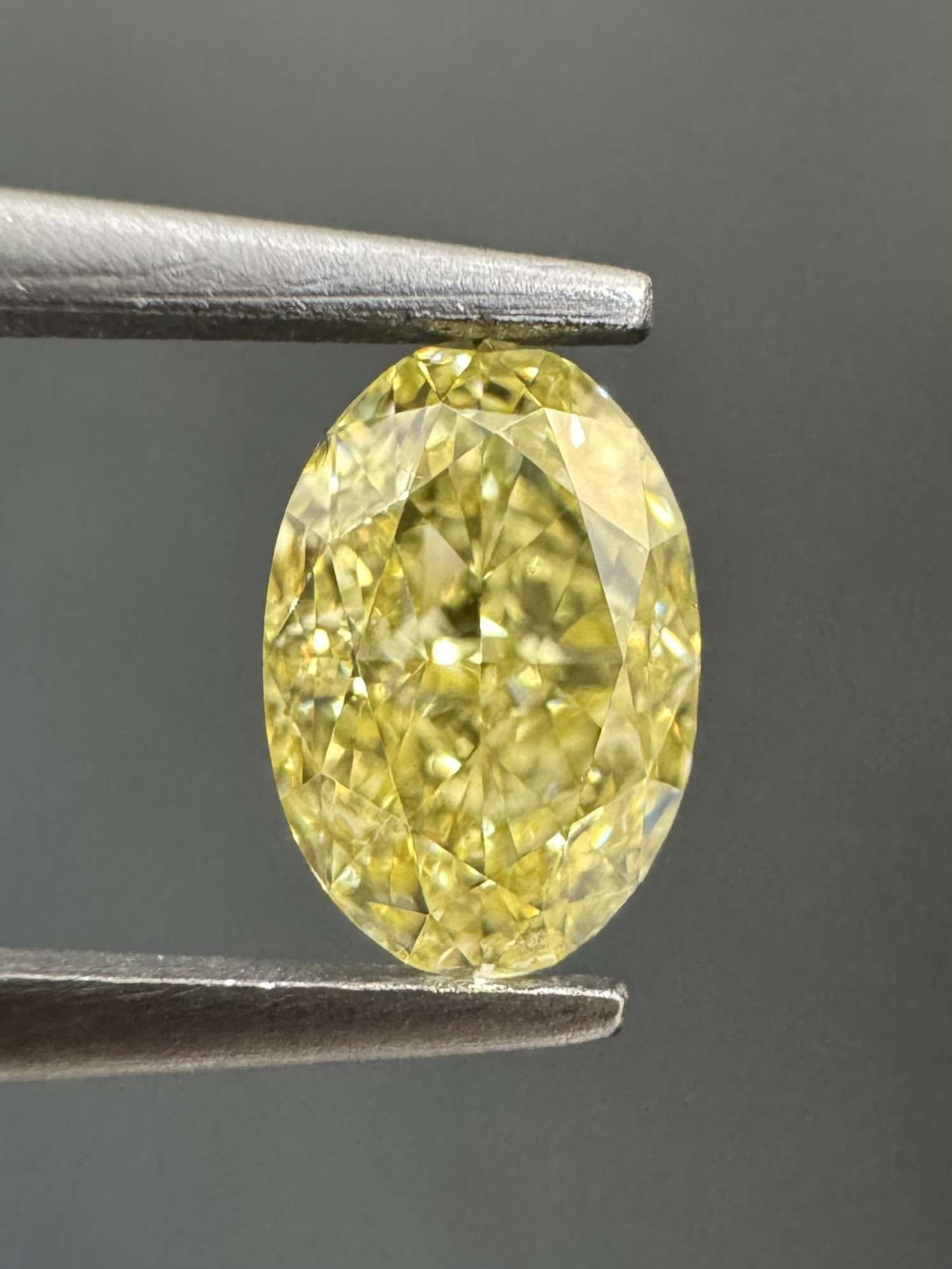 GIA Oval 0.53ct Fancy Yellow VVS1 - Loose Natural Diamond: GIA Oval 0.53ct Fancy Yellow VVS1 - Loose Natural Diamond GIA Oval 0.53ct Fancy Yellow VVS1 - Loose Natural Diamond, certified by the Gemological Institute of America (GIA) with a fancy yellow color, 
