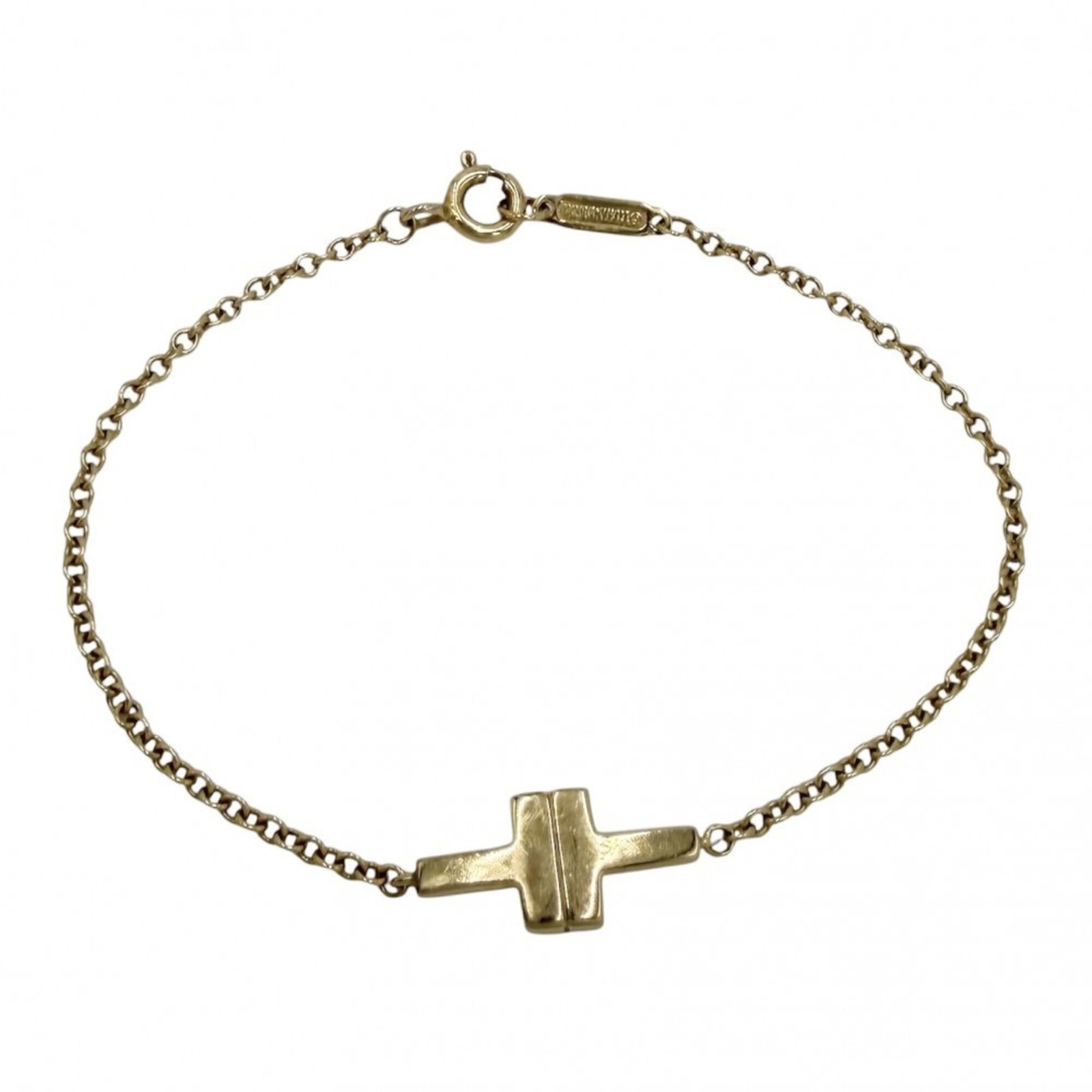 Charm Tiffany Bracelet: Charm Tiffany Bracelet 18K gold charm bracelet with a yellow metal finish, measuring 14cm in length. This Tiffany Type charm bracelet features a notable design element that sets it apart. The delicate