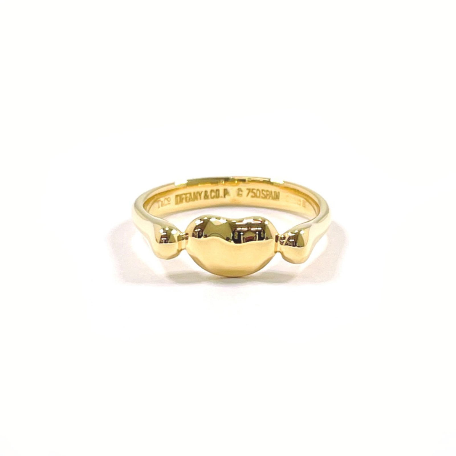 Tiffany ring gold 18k yellow band: Tiffany ring gold 18k yellow band 18k yellow gold band from Tiffany, crafted in Spain. This women's ring features a classic design with a bright and vibrant yellow hue that shines in the light. Made f