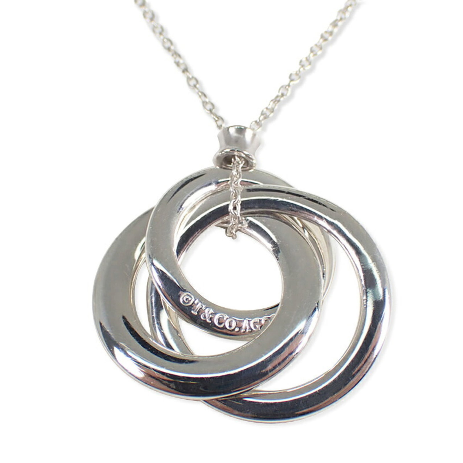 Tiffany & Co. 925 1837 Triple Interlocking Pendant Necklace: Tiffany & Co. 925 1837 Triple Interlocking Pendant Necklace Sterling silver 925 Tiffany & Co. necklace features an intricate triple interlocking design, showcasing the iconic brand's signature style. 