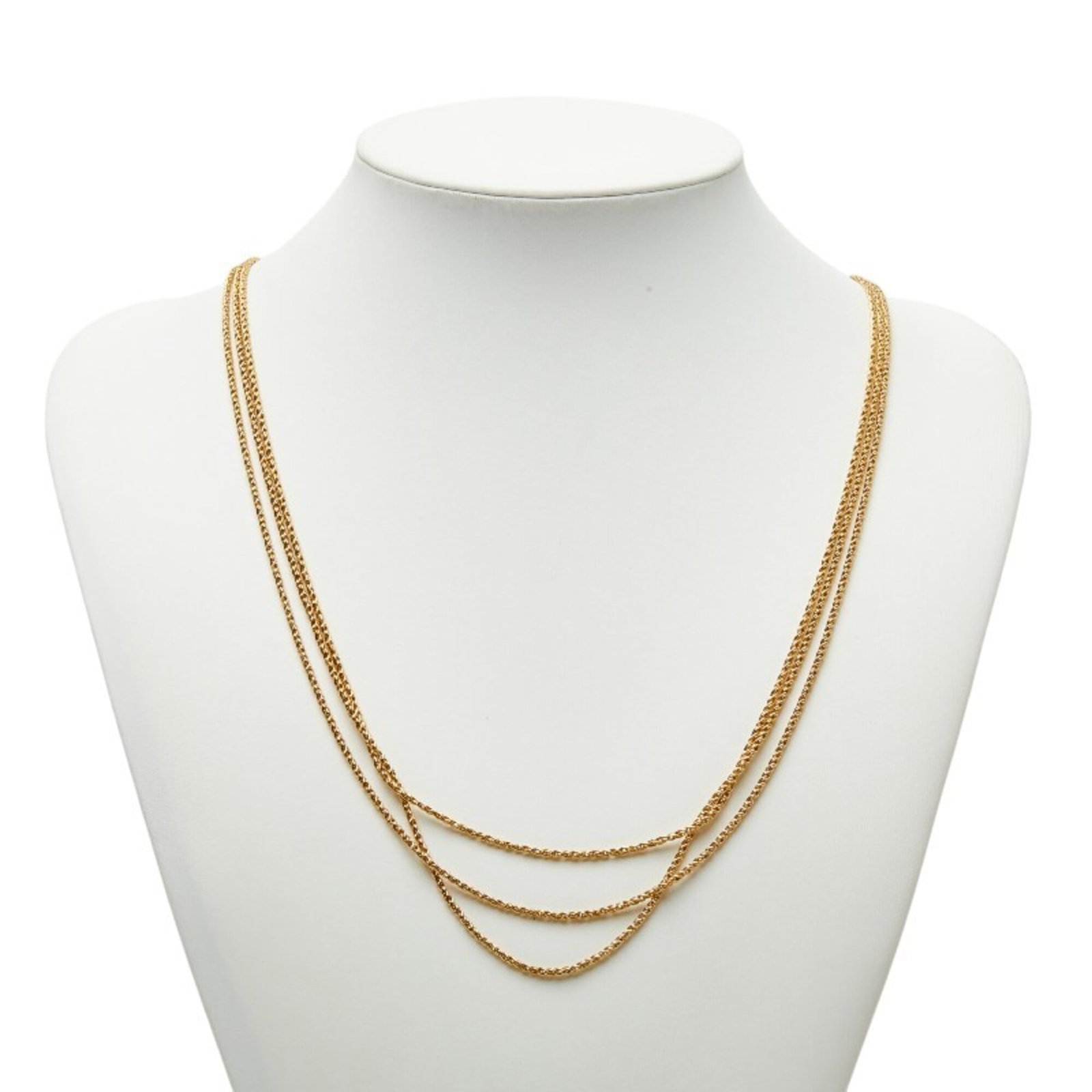 Christian Dior women's gold plated triple chain long necklace: Christian Dior women's gold plated triple chain long necklace Christian Dior's gold plated triple chain long necklace boasts a sleek and sophisticated design, featuring three delicate chains that casc