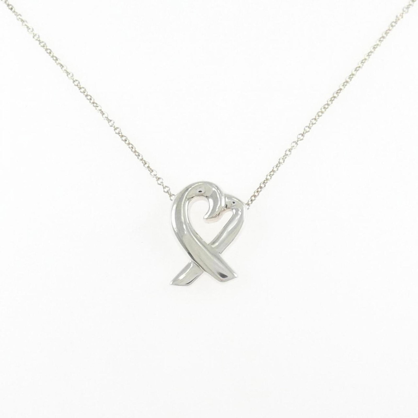 Small Heart Necklace by Tiffany: Small Heart Necklace by Tiffany Silver 925 chain necklace with a small heart pendant, measuring 15mm x 11mm. The necklace features a sterling silver construction and has a comfortable neck circumferen