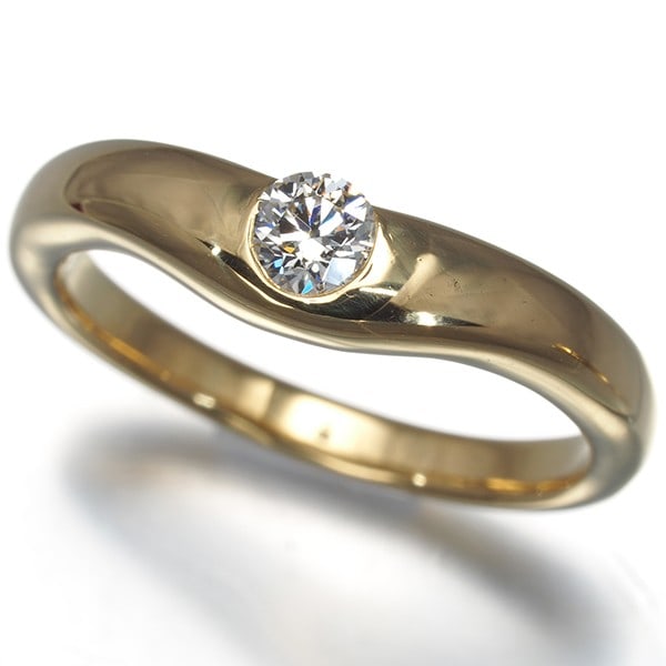 US6-6.25 18K 750 Yellow Gold Ring Curved Diamond Tiffany&Co: US6-6.25 18K 750 Yellow Gold Ring Curved Diamond Tiffany&Co 18K yellow gold ring with a natural diamond, bearing the iconic Tiffany & Co. mark, offers a touch of timeless elegance to any outfit. The c