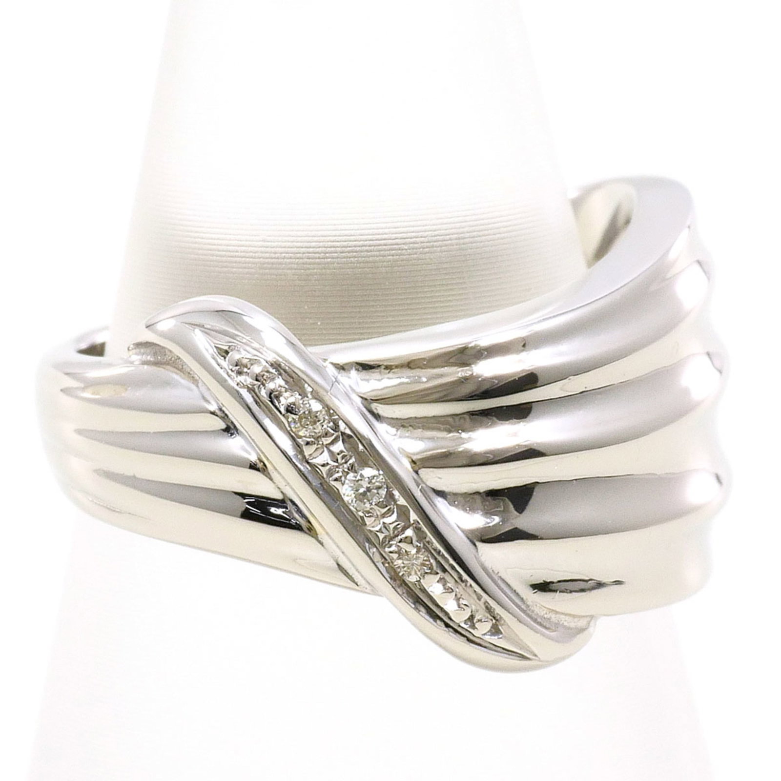 Band ring platinum unbranded: Band ring platinum unbranded Platinum band ring features a diamond stone, weighing 0.02 carats, set in a platinum metal construction with a US size 4 fit and 13mm width. The item weighs 6.4 grams and 