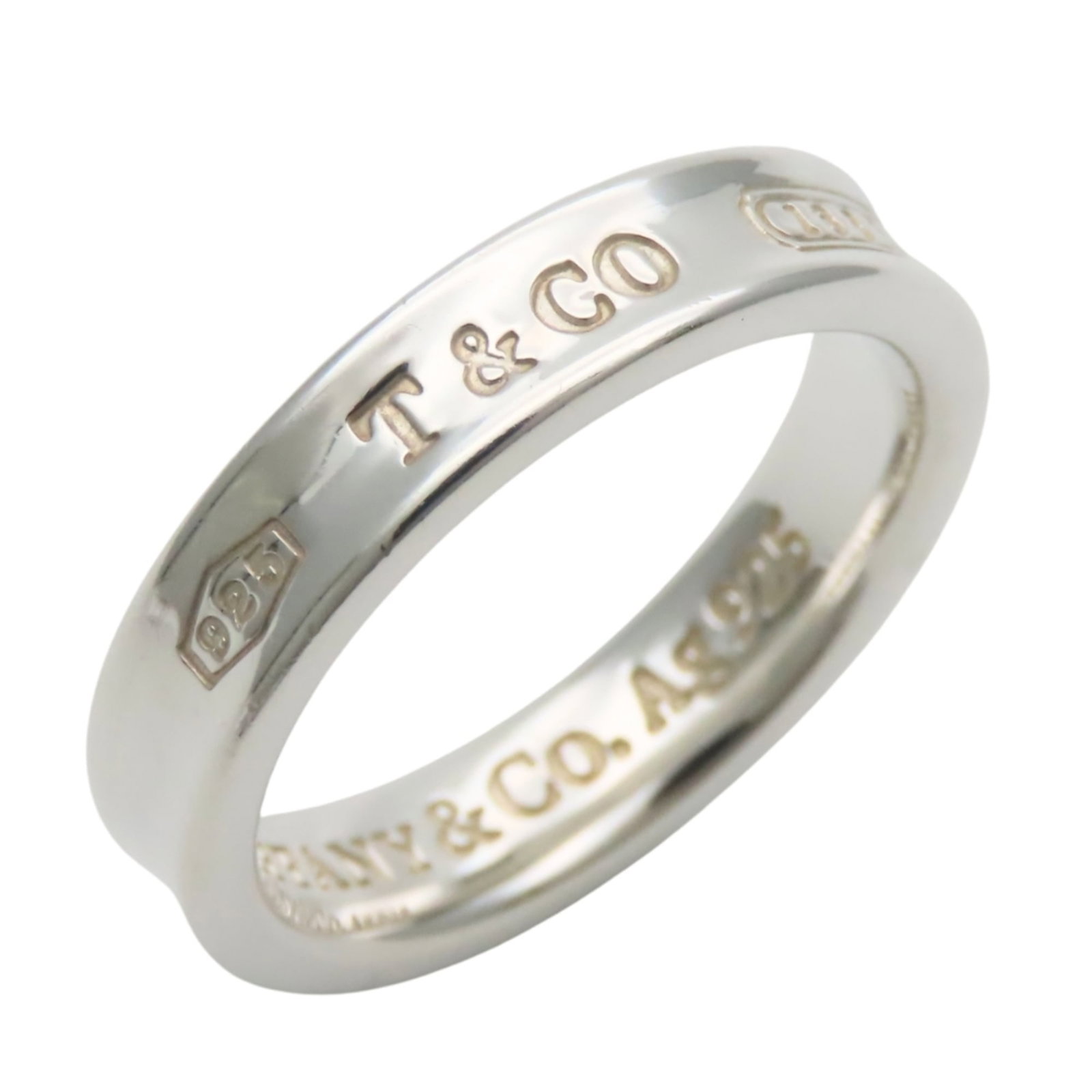 Silver Ring Band Tiffany: Silver Ring Band Tiffany Silver Ring Band Tiffany is made from 925 silver, offering a durable and long-lasting finish. The band features a sleek design with a width of 4mm and weighs approximately 3.8