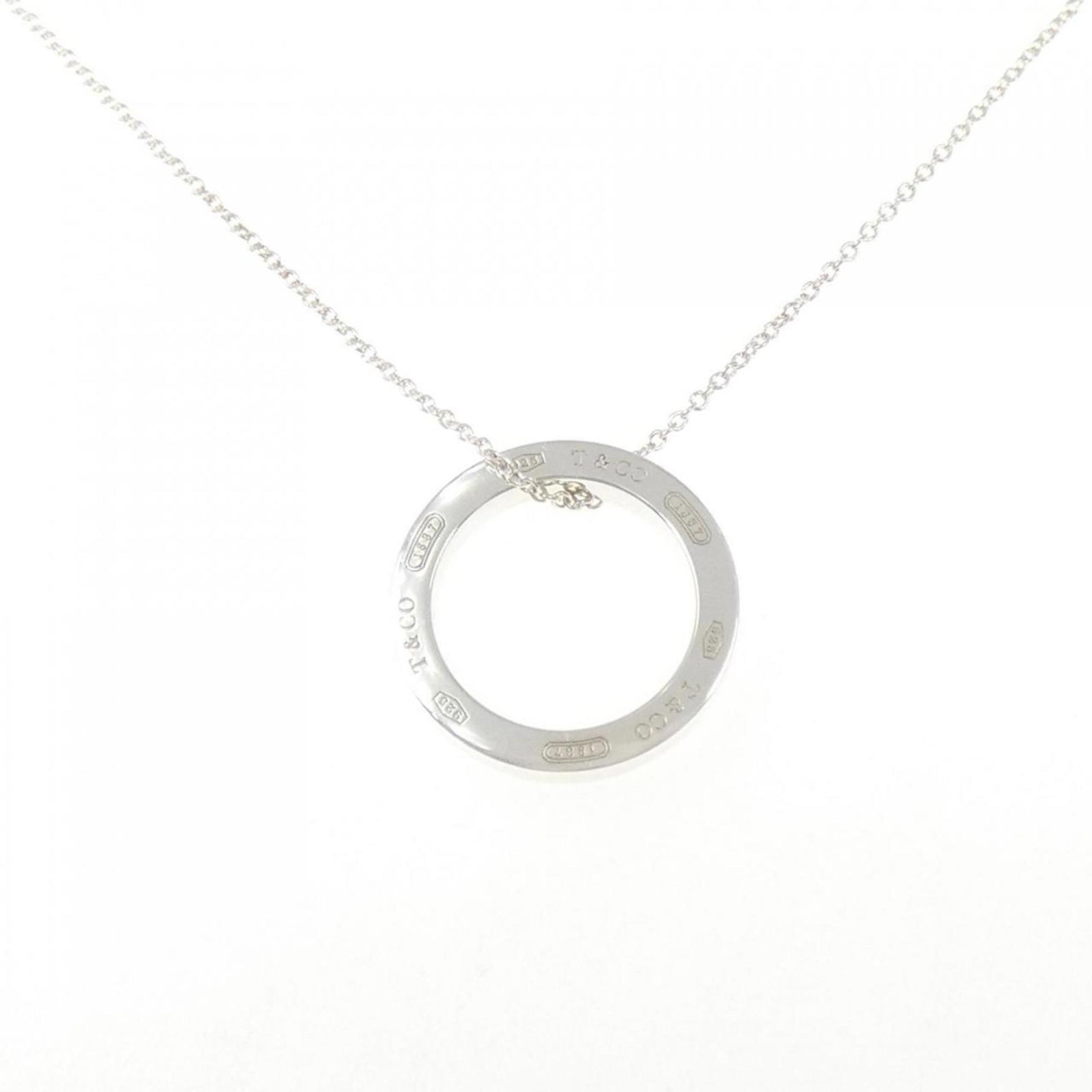 Circle Tiffany Necklace 1837: Circle Tiffany Necklace 1837 Silver Circle Tiffany Necklace, circa 1837, boasts an elegant design with a 17.7mm x 17.7mm silver pendant suspended from a 40cm chain, perfect for adding a touch of vinta
