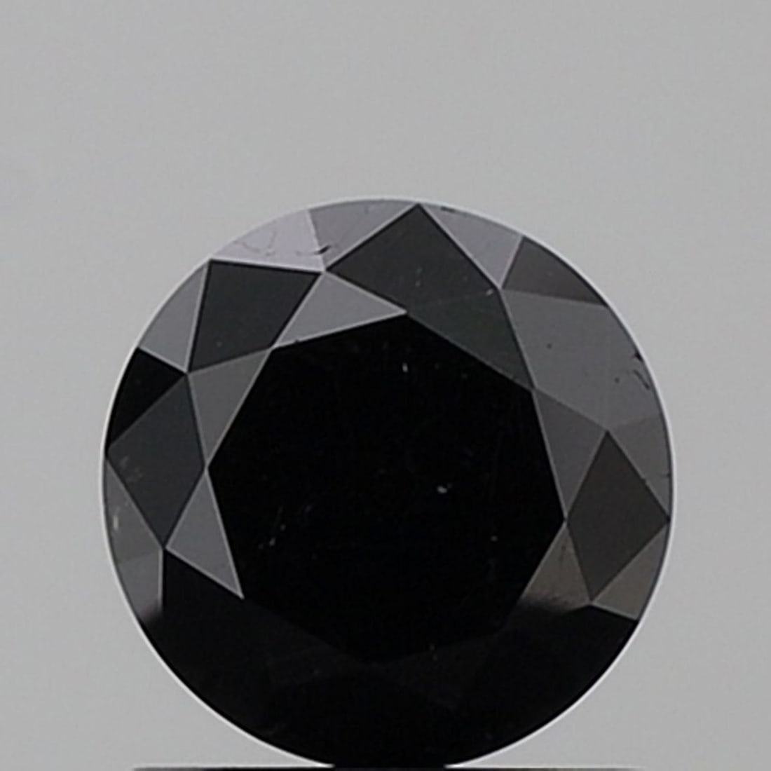 Round 1.25ct Fancy Black VVS2 - Loose Natural Diamond: Round 1.25ct Fancy Black VVS2 - Loose Natural Diamond 1.25ct Fancy Black VVS2 - A rare and striking natural diamond, boasting an EX cut, EX symmetry, and EX polish, with a clarity grade of VVS2. Its