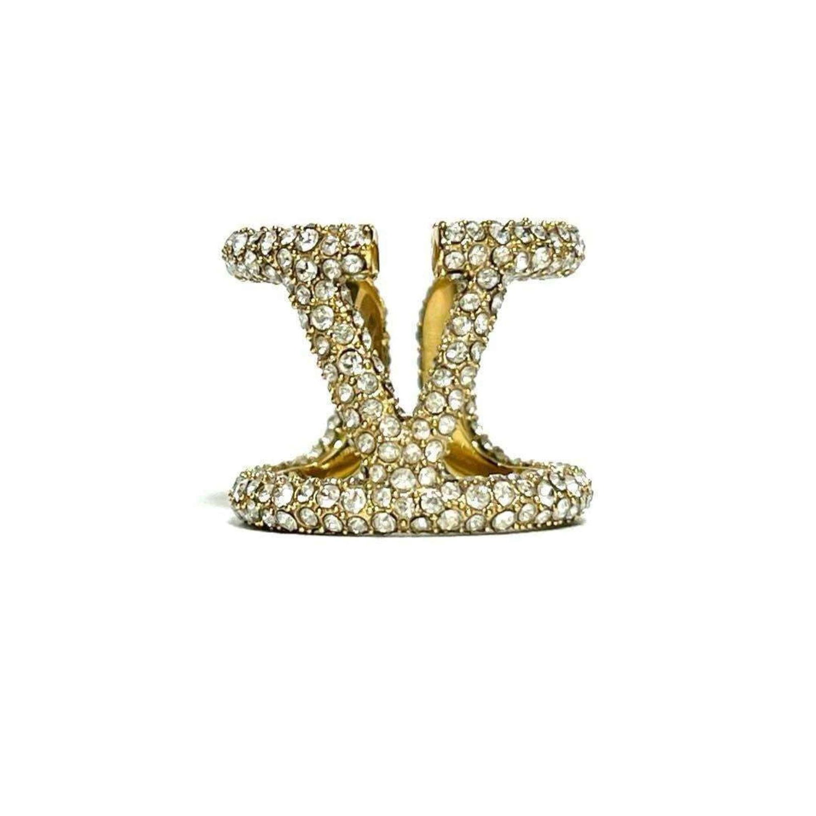 Valentino Band Ring Metal Rhinestone: Valentino Band Ring Metal Rhinestone Valentino Band Ring Metal Rhinestone - A gold band ring adorned with metal and rhinestones, showcasing the brand's signature style. This elegant piece features a