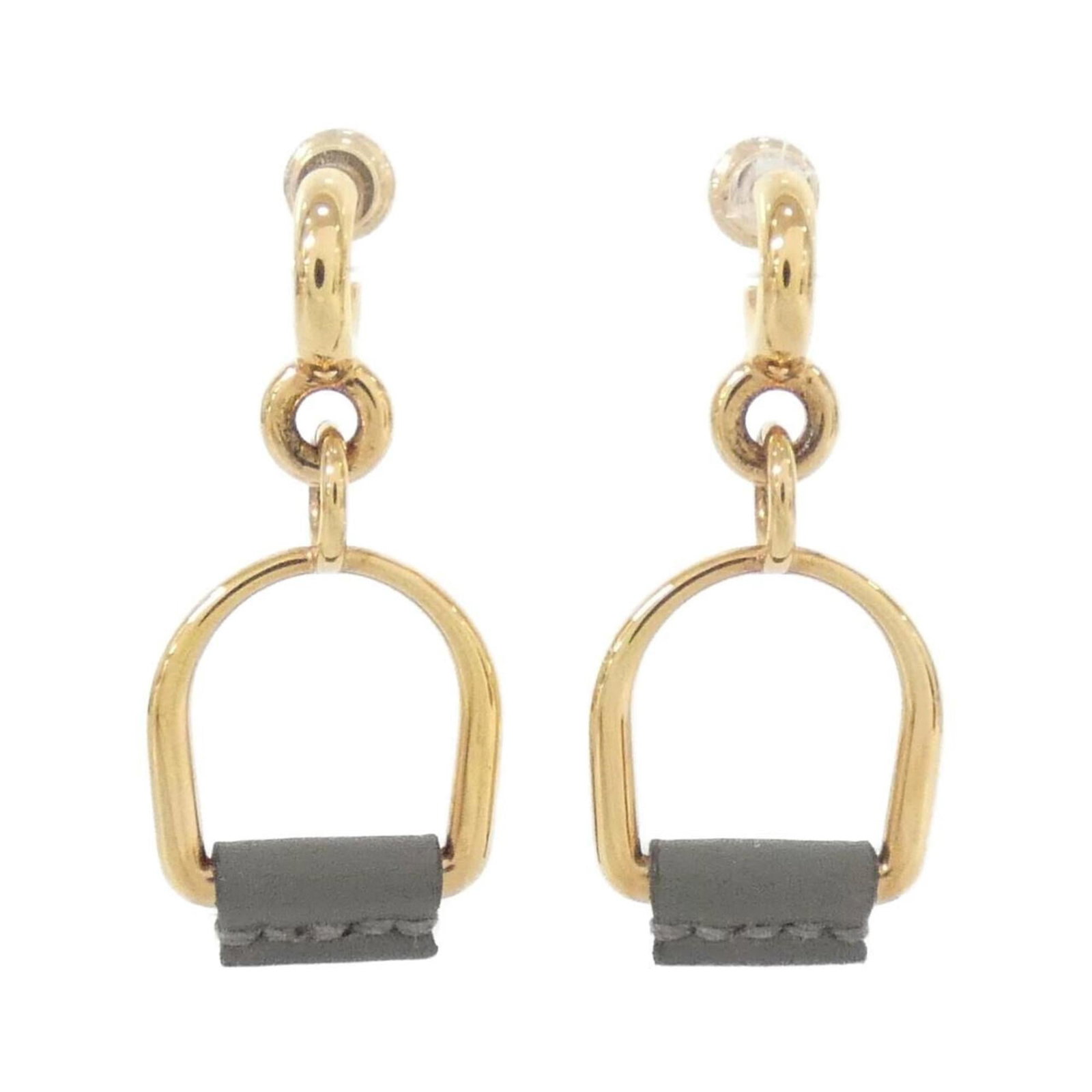 Swift leather earrings by Hermes stud: Swift leather earrings by Hermes stud Swift leather earrings by Hermes stud boast sleek, modern design with subtle gold and gray tones. Made from high-quality Swift leather, these stud earrings offer 