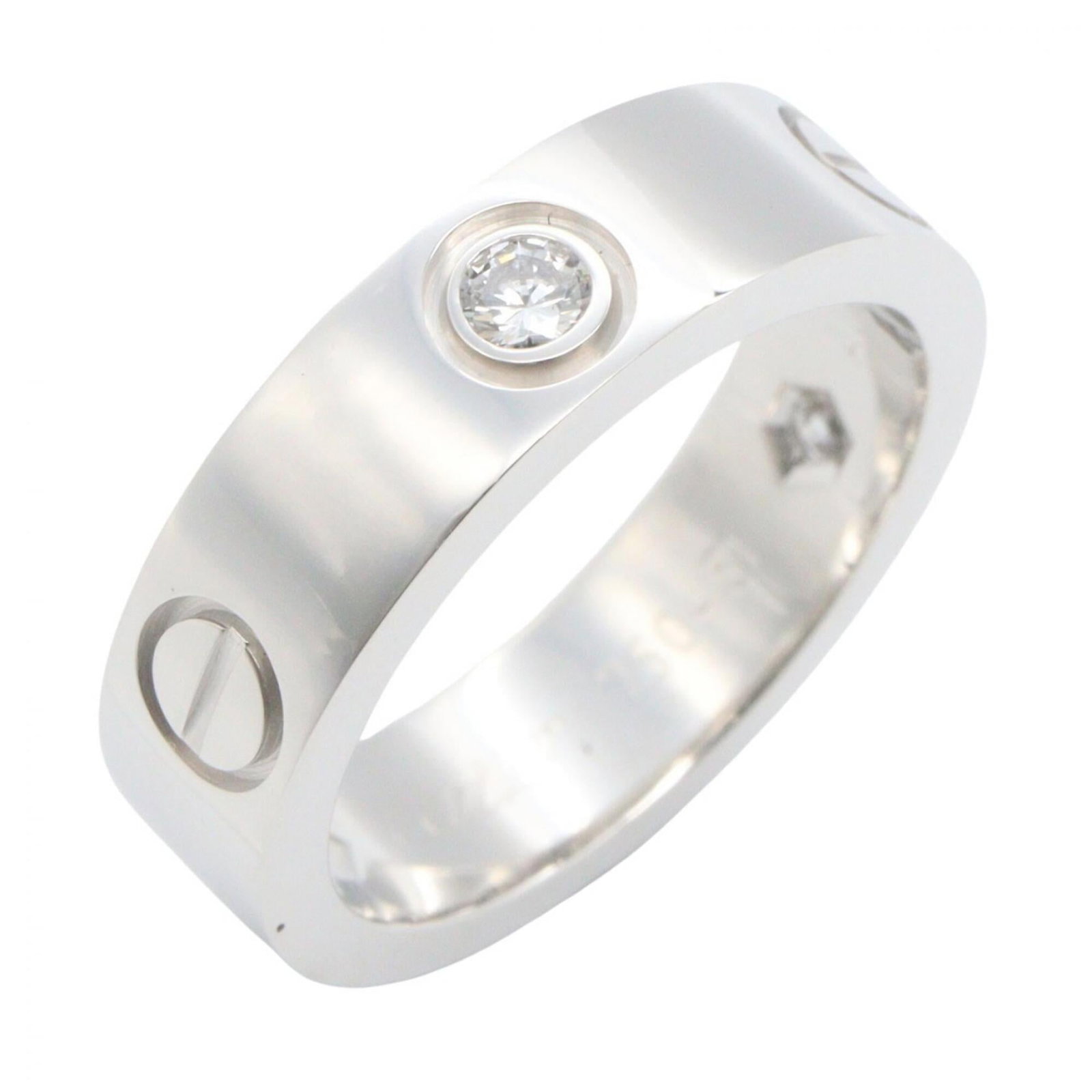 White Gold Band Ring by Cartier 18K: White Gold Band Ring by Cartier 18K White Gold Band Ring by Cartier 18K features a clear, silver band made from high-quality white gold (18K). This elegant ring is available in US size 5.5 and bears t