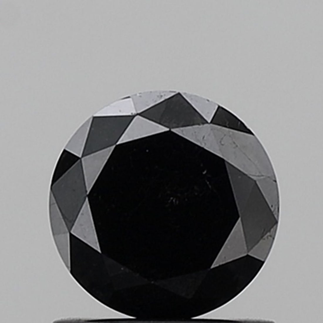 Round 1.09ct Black VVS2 - Loose Natural Diamond: Round 1.09ct Black VVS2 - Loose Natural Diamond 1.09ct Black VVS2 - A rare and striking natural diamond, certified as EX in cut, color, polish, and symmetry, boasting a high clarity grade of VVS2. Its