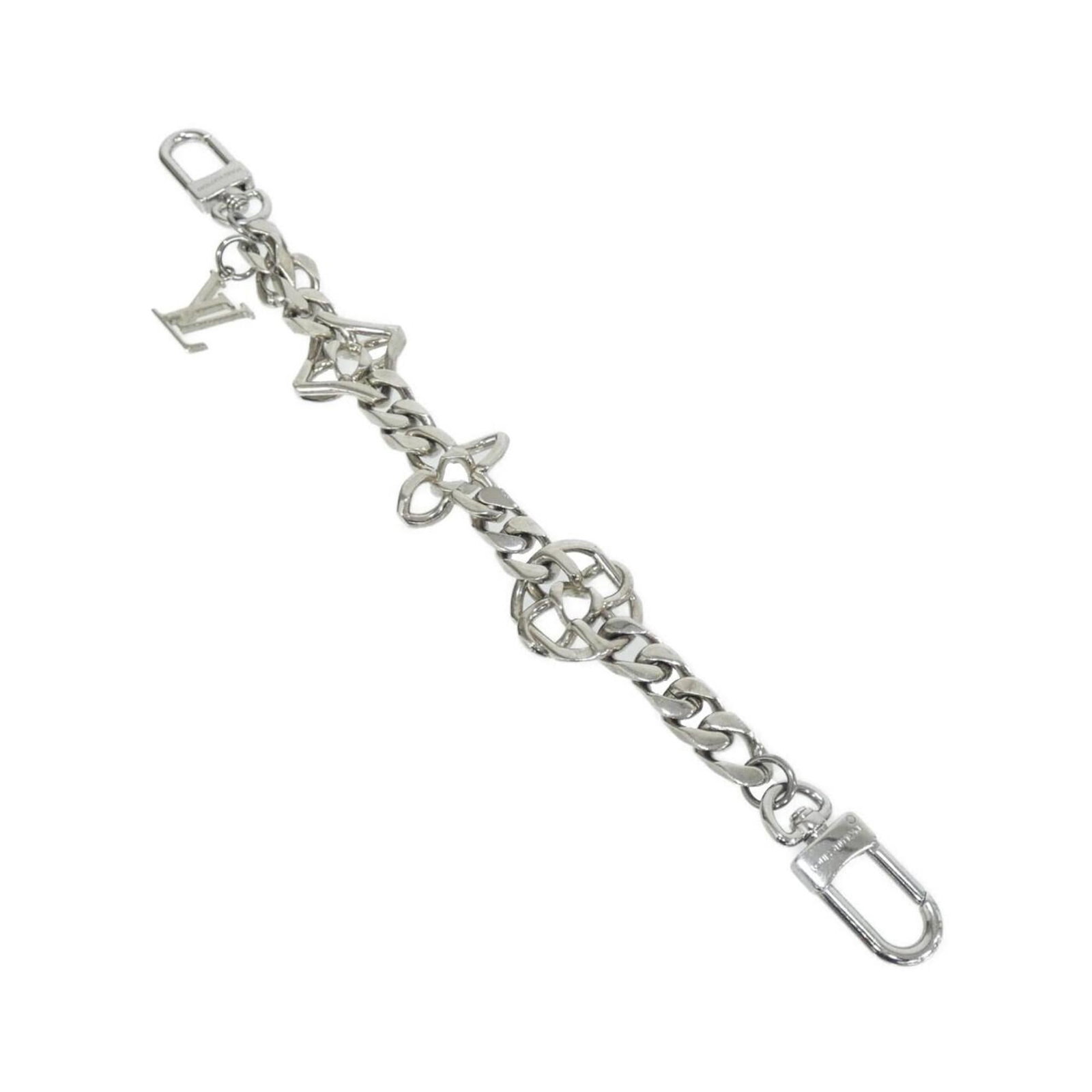 Handbag Louis Vuitton Charm: Handbag Louis Vuitton Charm Silver Louis Vuitton charm, bearing the MPN M01398, adds a touch of elegance to any accessory. This handbag charm is made from high-quality materials and features a sleek