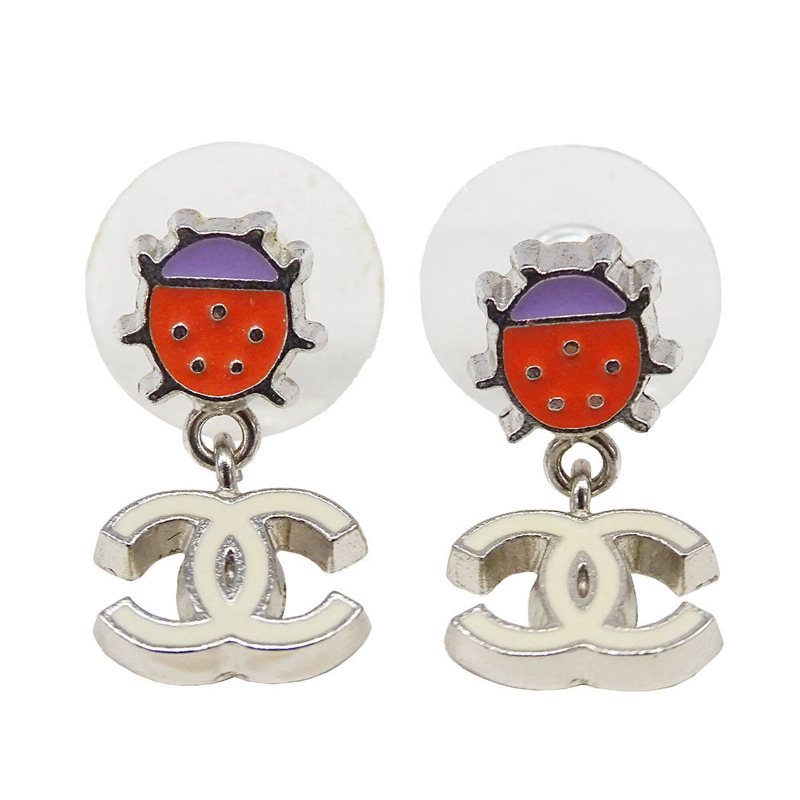 Metal stud earrings by Chanel: Metal stud earrings by Chanel Metal stud earrings by Chanel, crafted in France with a multi-color and silver finish. Measuring 18.00mm x 10.10mm, these small yet striking earrings are made from metal.