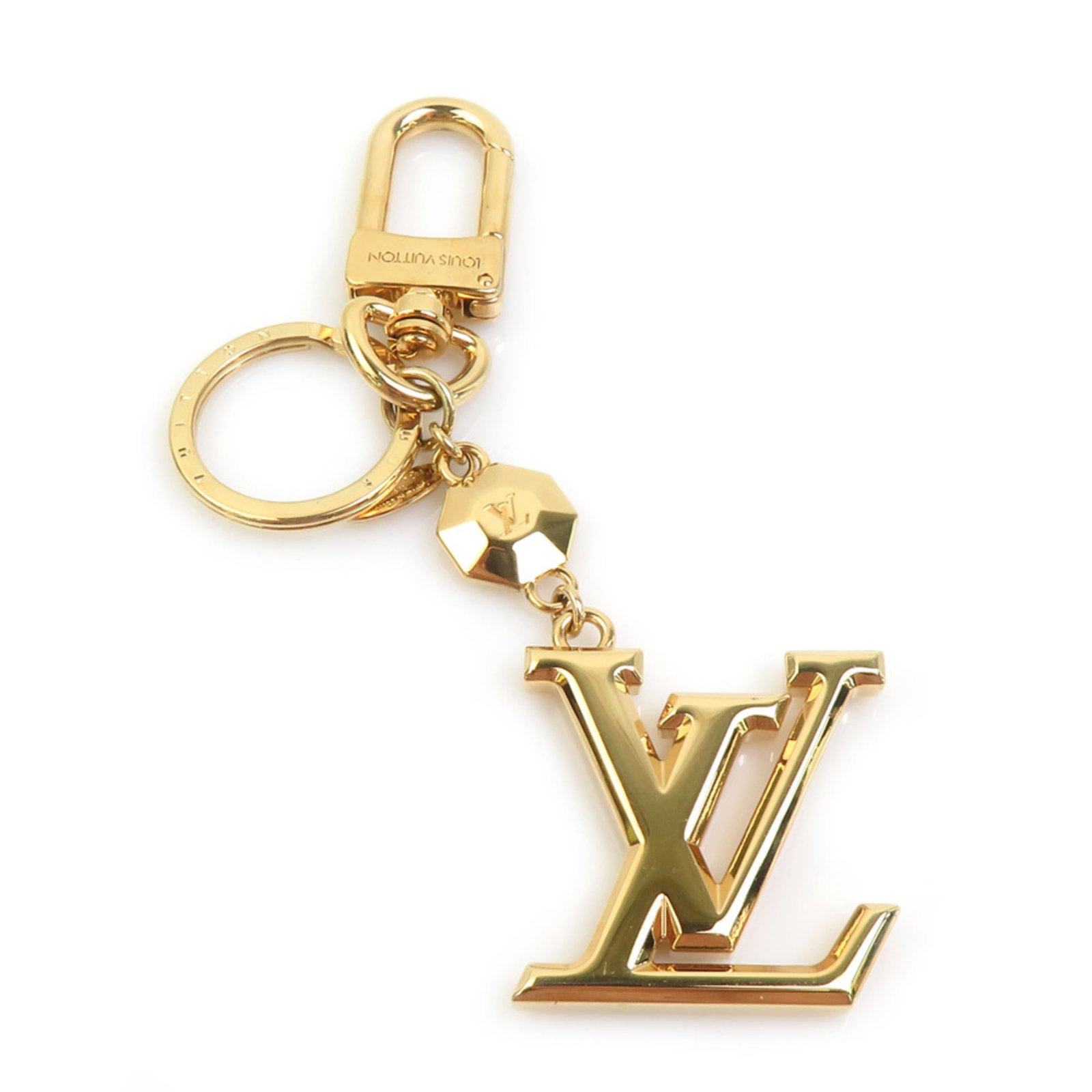 Metal Handbag Charm Louis Vuitton: Metal Handbag Charm Louis Vuitton Metal Handbag Charm Louis Vuitton bears the signature of its creator, crafted from gold metal with precise measurements of 120.00mm x 37.00mm. This intricately design