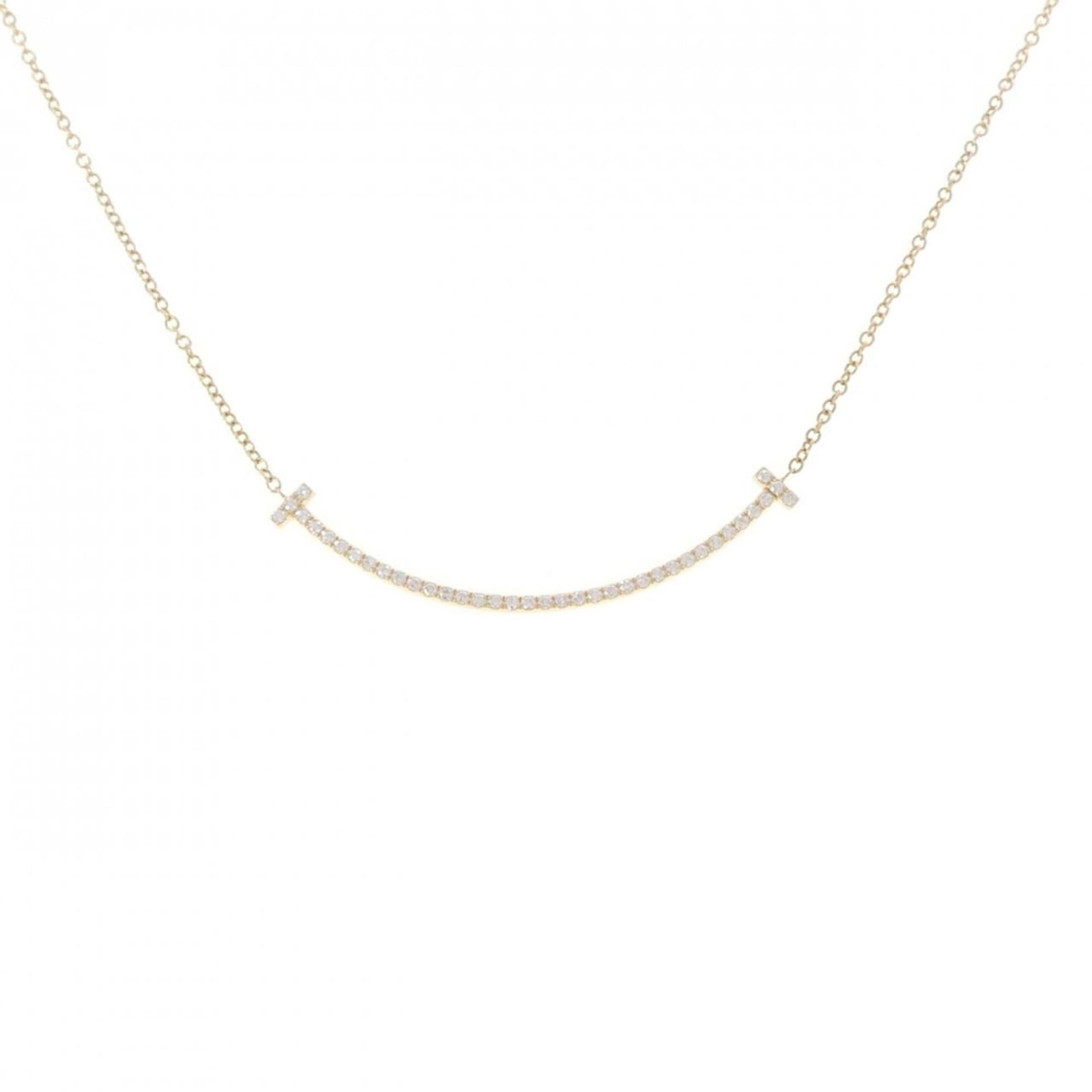 Tiffany necklace smile small: Tiffany necklace smile small Yellow gold (18K) pendant necklace with a small, delicate smile design. The 40 cm / 15.74'' adjustable chain allows for a comfortable fit, while the 3.5mm x 36.9mm pendant