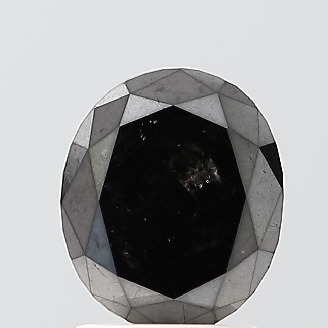 Oval 1.37ct Black VVS2 - Loose Natural Diamond: Oval 1.37ct Black VVS2 - Loose Natural Diamond Oval cut diamond with exceptional clarity and polish, boasting a rare black color. Measuring 7.91L x 6.65W x 3.03H, this natural Fancy diamond shines wit