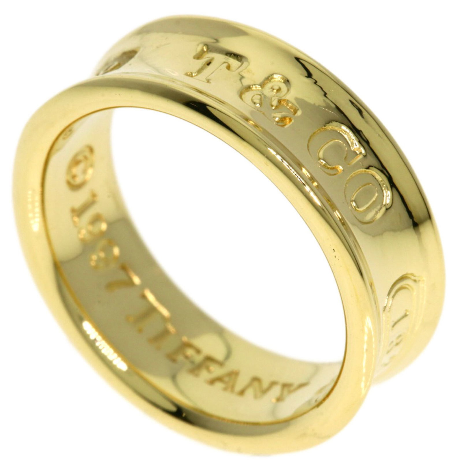 Tiffany ring gold 18k yellow band: Tiffany ring gold 18k yellow band 18k yellow gold band ring from Tiffany, featuring a classic design with a sturdy construction. The US size 4.5 band provides a comfortable fit for women's hands. Made