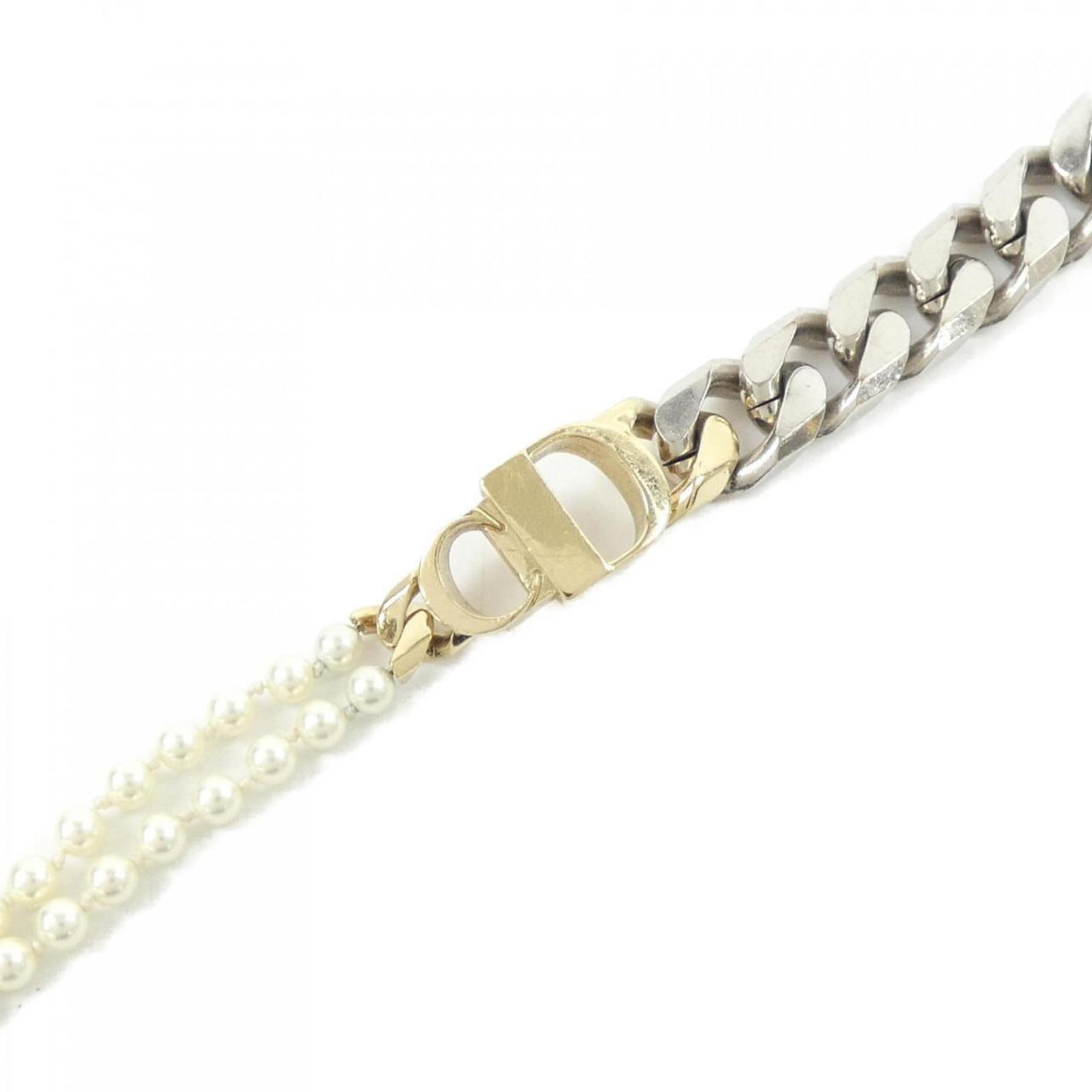 Christian Dior Charm Bracelet: Christian Dior Charm Bracelet Silver and white charm bracelet from Christian Dior, featuring a sleek design with a total length of 19.2cm. The M-sized bracelet boasts a width of 1.5cm, making it a sty