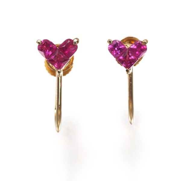 Ruby 0.20Ct/ 0.20Ct Heart Earrings 18K 750 Yellow Gold: Ruby 0.20Ct/ 0.20Ct Heart Earrings 18K 750 Yellow Gold 18K yellow gold earrings showcase two natural rubies, each weighing 0.20ct, suspended from a delicate clip-on design. The intricate details of th