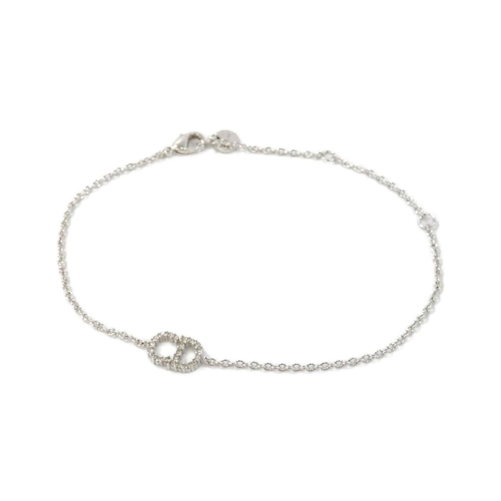Christian Dior Charm Bracelet: Christian Dior Charm Bracelet The Christian Dior charm bracelet boasts a sleek, silver design with clear accents, offering a versatile and elegant accessory for everyday wear. Its adjustable length al