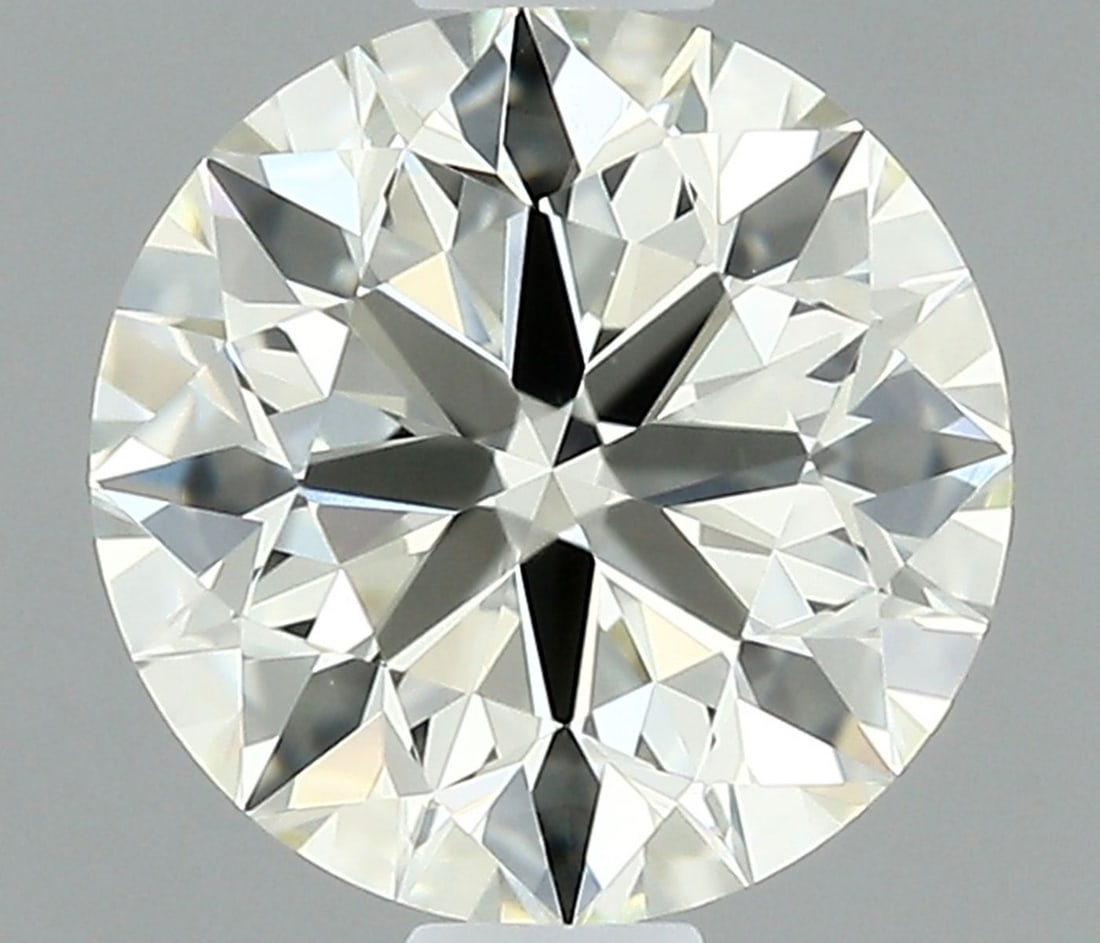 IGI Round 0.71ct K VVS1 - Loose Natural Diamond: IGI Round 0.71ct K VVS1 - Loose Natural Diamond 0.71ct K VVS1 - A Rare Natural Diamond with Exceptional Clarity and Cut. This IGI-certified diamond boasts an EX polish, symmetry, and clarity grade, ma