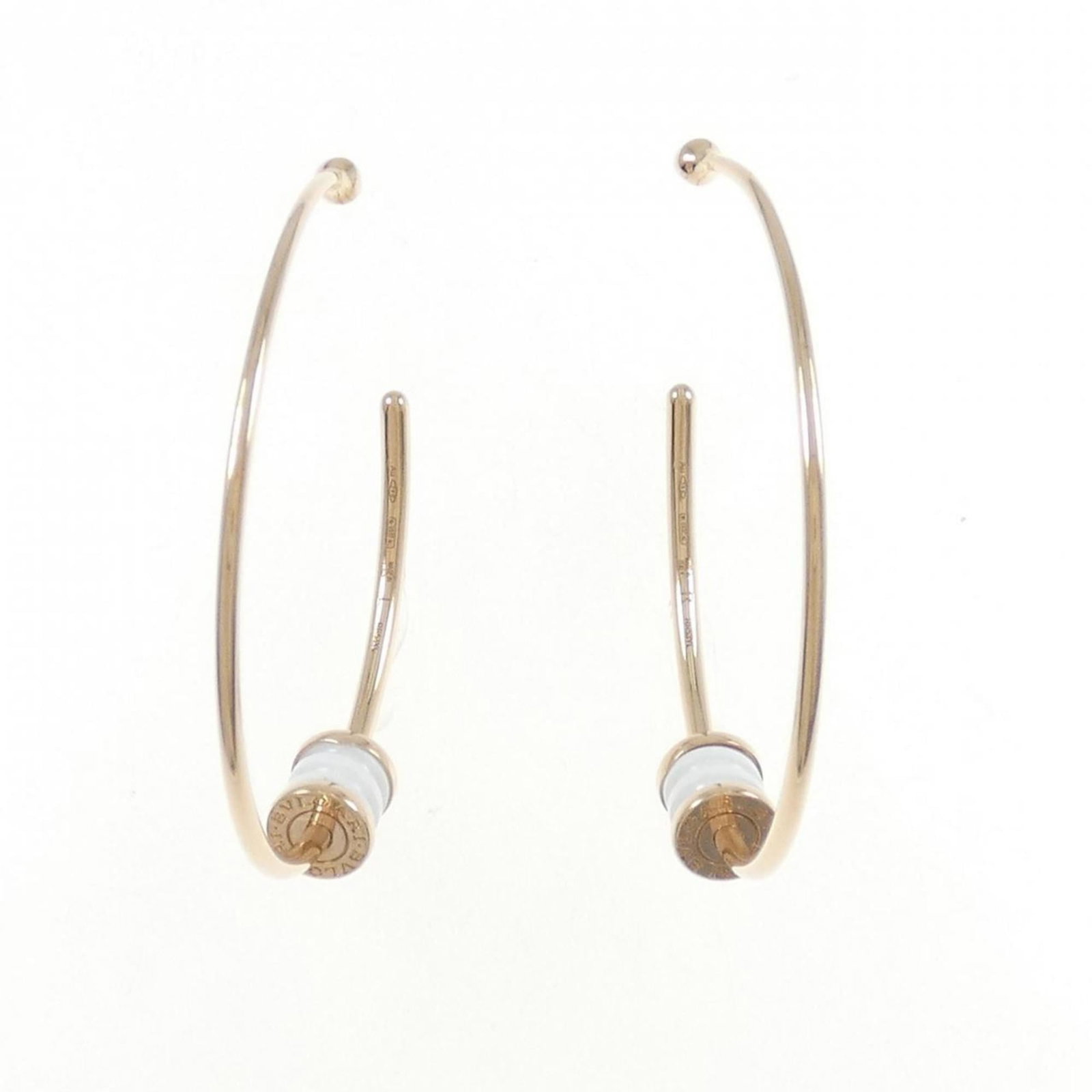 Gold Pink Ceramic Earrings Hoop Bvlgari Half: Gold Pink Ceramic Earrings Hoop Bvlgari Half Bvlgari's gold pink ceramic half hoop earrings are a statement piece, featuring 18K pink gold and vibrant ceramic details. The elegant design is