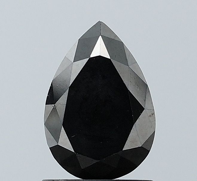 Pear 1.56ct Fancy Black VVS2 - Loose Natural Diamond: Pear 1.56ct Fancy Black VVS2 - Loose Natural Diamond The 1.56ct Fancy Black VVS2 diamond boasts exceptional clarity and polish, with its EX symmetry adding to its allure. This loose natural diamond's