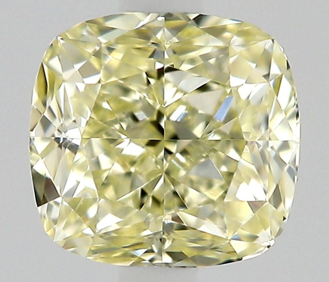 Cushion Brilliant 0.34ct Fancy Light Yellow VVS1 - Loose Natural Diamond: Cushion Brilliant 0.34ct Fancy Light Yellow VVS1 - Loose Natural Diamond 0.34ct Fancy Light Yellow VVS1 diamond, boasting exceptional clarity and vibrant color, sits atop its cushion setting in loose